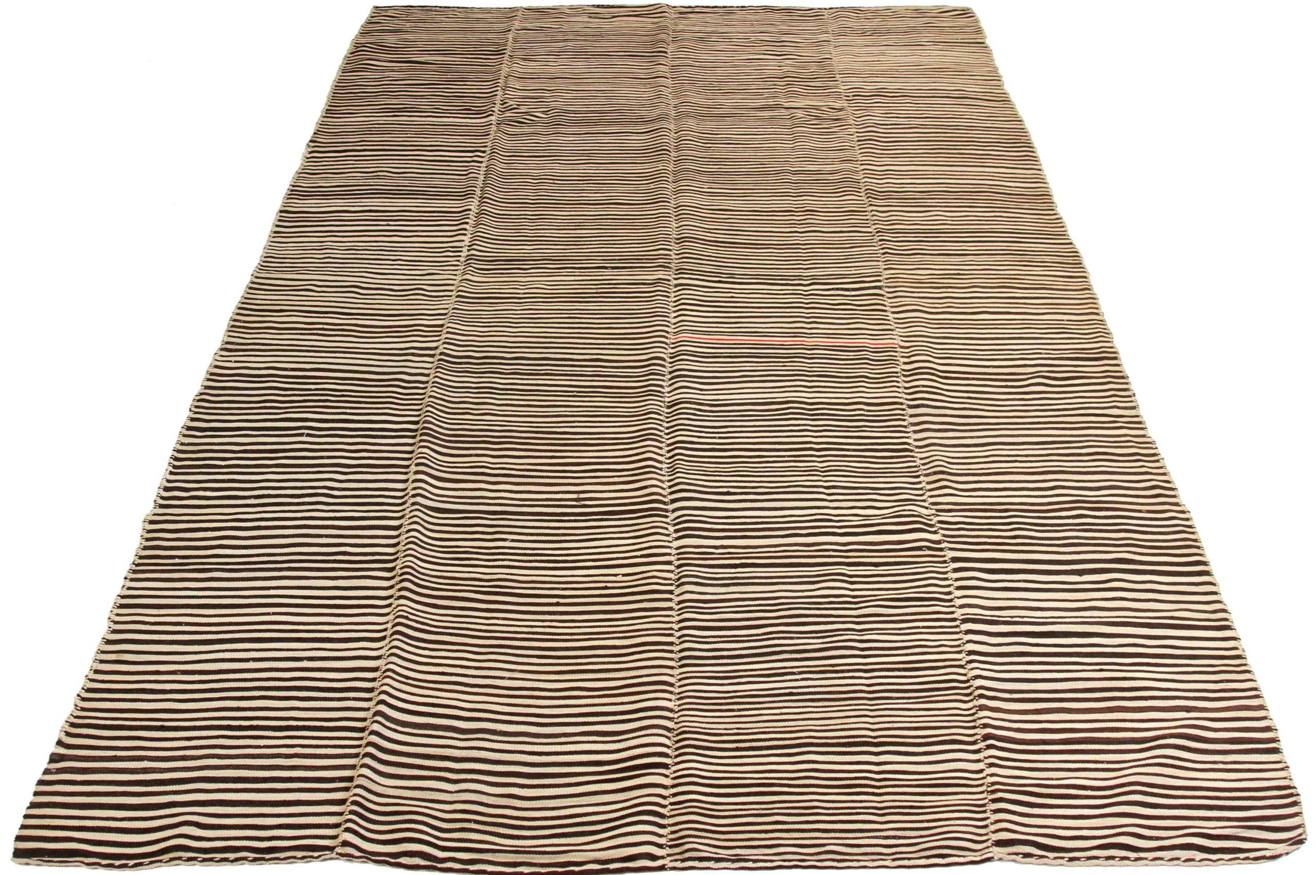 Discover the elegance of Persian Kilim featuring Area Rugs in Circa 1910. Designed with Wool and BrownIvory, this exclusive design is perfect for enhancing your space.