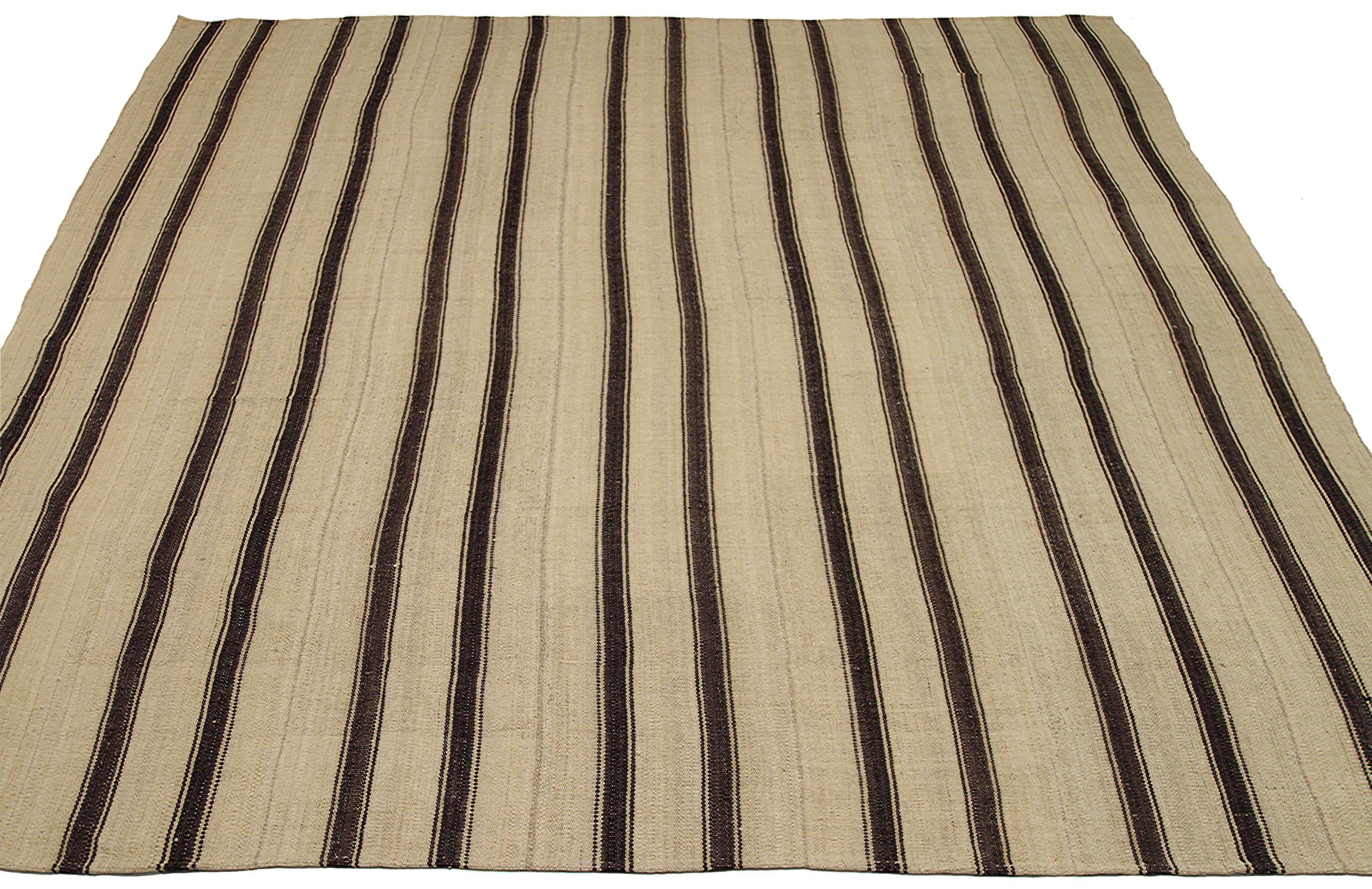 Discover the elegance of Persian Kilim featuring Area Rugs in Circa 1910. Designed with Wool and BrownIvory, this exclusive design is perfect for enhancing your space.