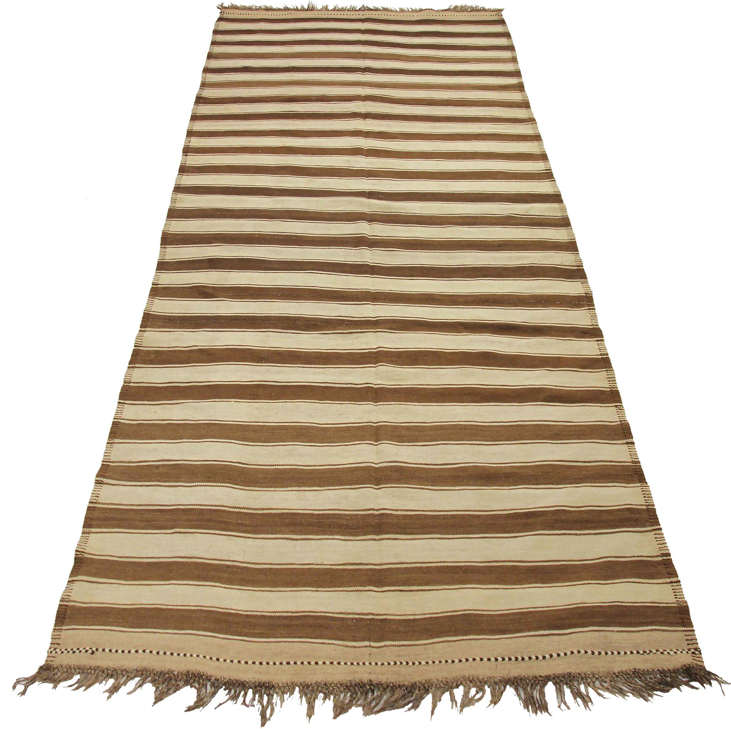 Discover the elegance of Persian Kilim featuring Area Rugs in Circa 1910. Designed with Wool and BrownIvory, this exclusive design is perfect for enhancing your space.
