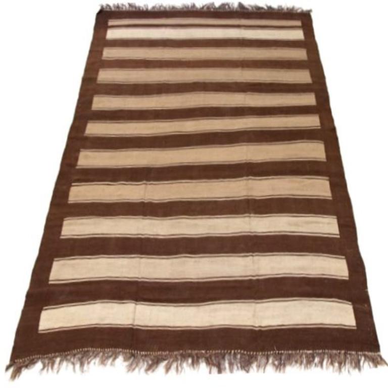 Discover the elegance of Persian Kilim featuring Area Rugs in Circa 1880. Designed with Wool and BrownIvoryTaupe, this exclusive design is perfect for enhancing your space.