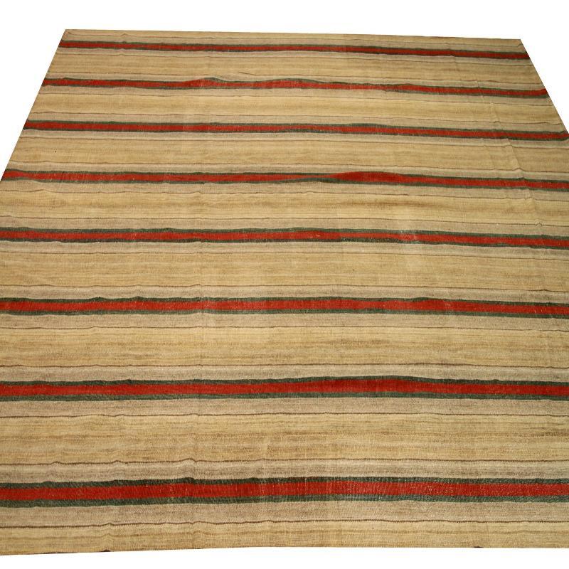 Discover the elegance of Persian Kilim featuring Area Rugs in Circa 1880. Designed with Wool and GreenIvoryRed, this exclusive design is perfect for enhancing your space.