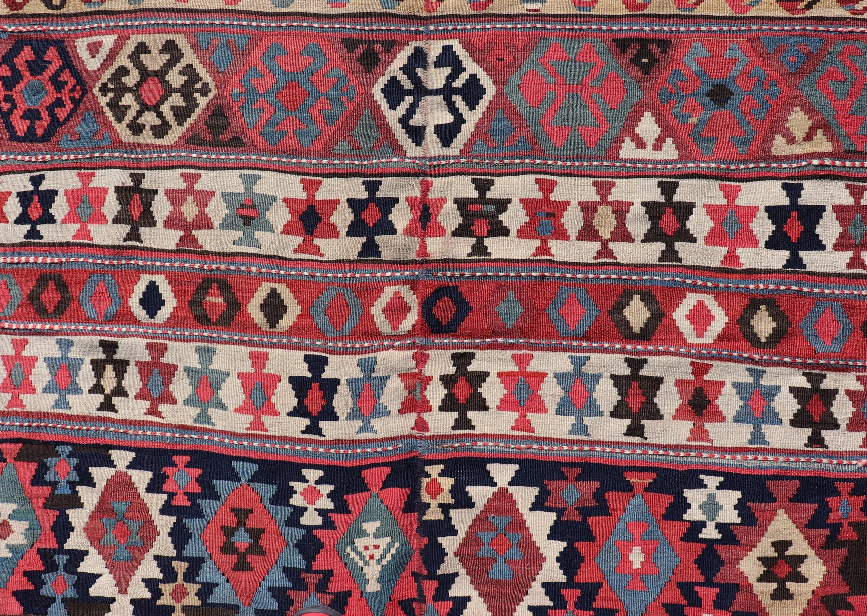 20th Century Persian Kilim Rug with Bold Tribal Geometric Patterns in Vivid Colors 4'9 x 6'9 For Sale