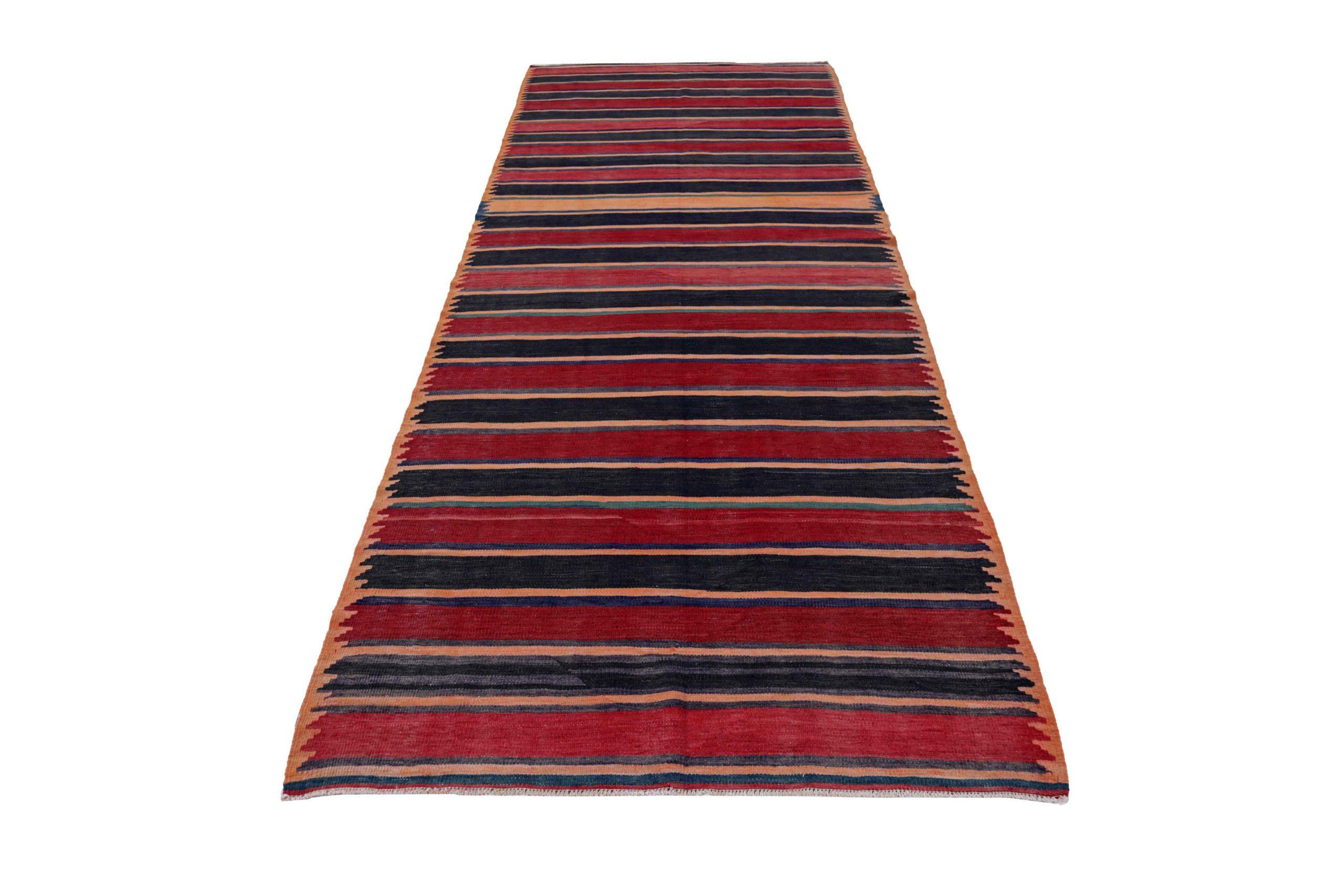 Discover the elegance of Persian Kilim featuring Runner Rug in Circa 1910. Designed with Wool and Navy BlueOrangeRedYellow, this exclusive design is perfect for enhancing your space.