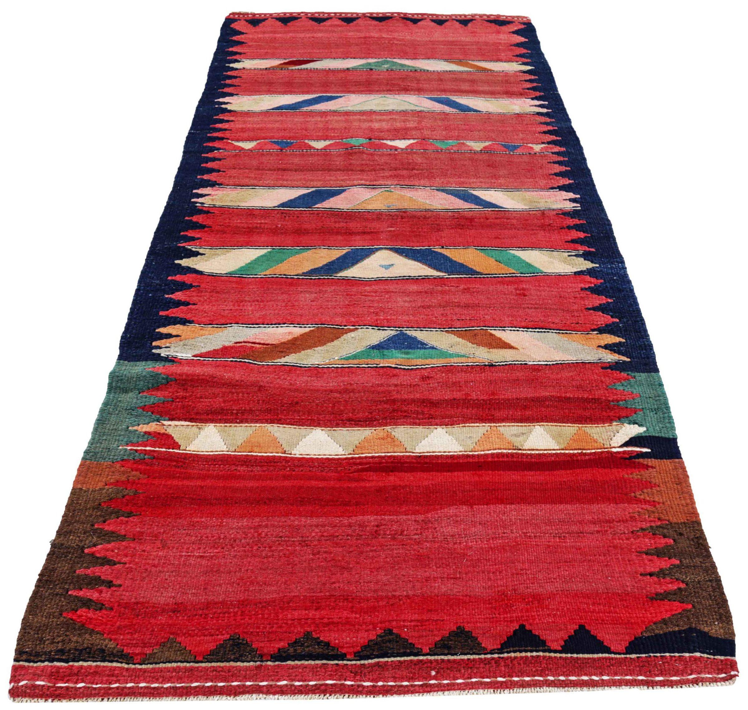 Entdecken Sie die Eleganz eines persischen Kilims mit einem kleinen Teppich von CIRCA 1910. Dieses exklusive Design aus Wolle und BlauGrünOrangeRot ist perfekt, um Ihren Raum zu verschönern.