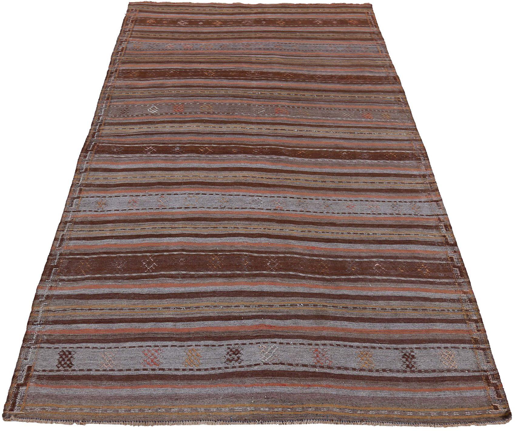 Entdecken Sie die Eleganz eines persischen Kilims mit einem kleinen Teppich von CIRCA 1910. Dieses exklusive Design aus Wolle und BraunGrauRosa ist perfekt, um Ihren Raum zu verschönern.