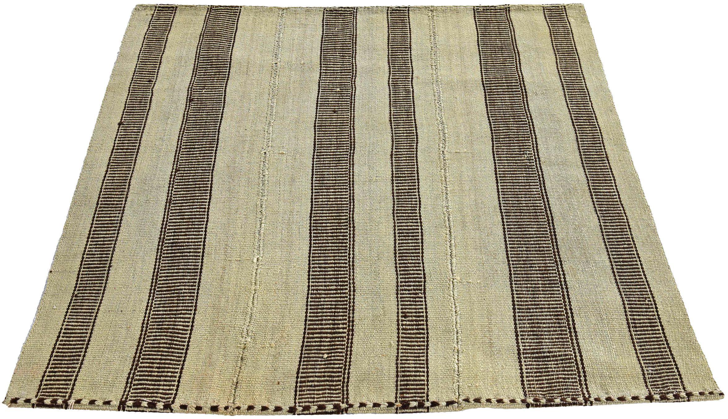 Discover the elegance of Persian Kilim featuring Small Rug in Circa 1910. Designed with Wool and BrownIvory, this exclusive design is perfect for enhancing your space.