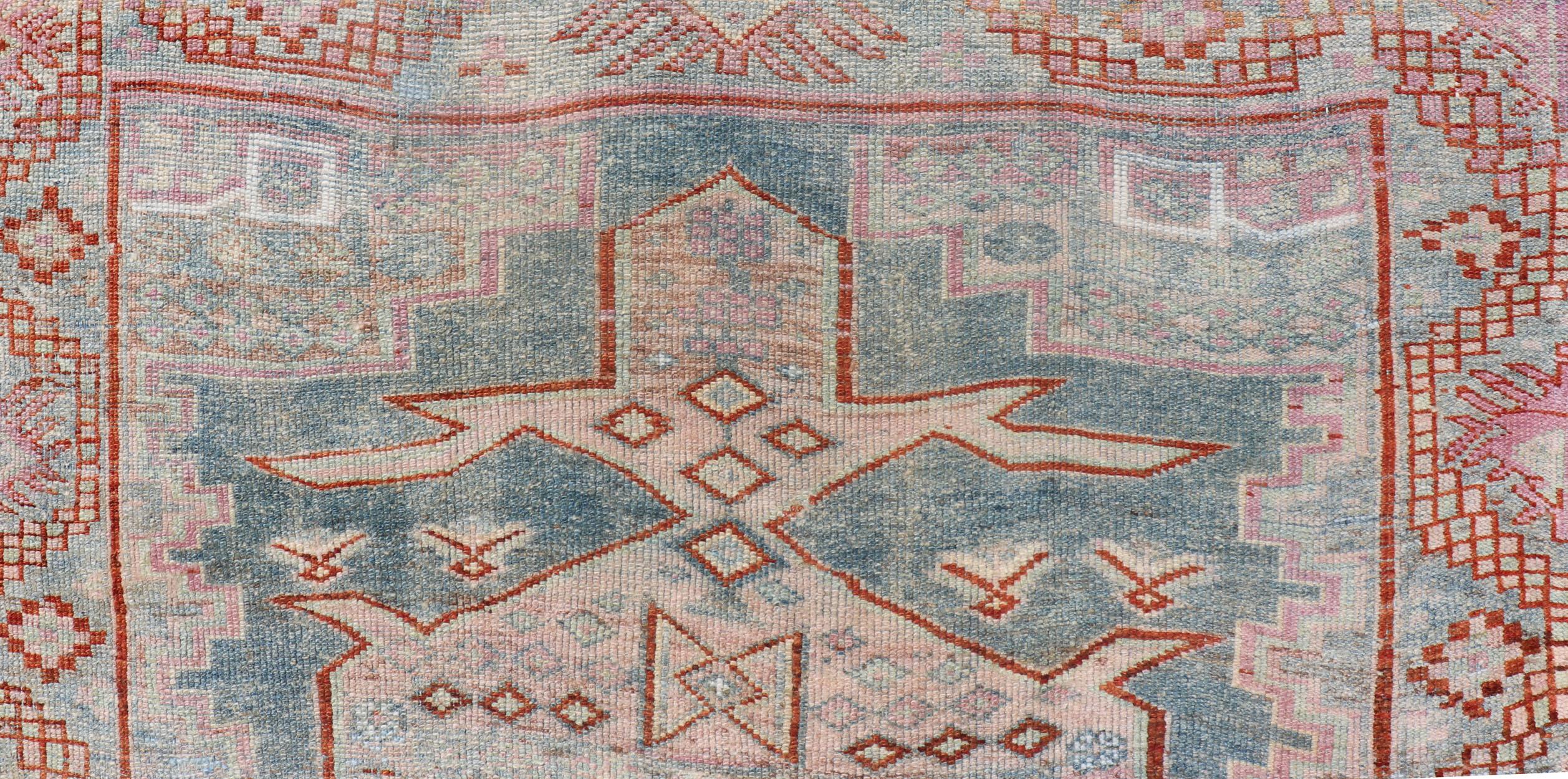 Measures:4'6 x 5'10 
Persian Kurdish Antique Rug with Tribal Design in Light Blue, Teal, Taupe & Red 

Antique Kurdish rug with tribal geometric medallions in soft blue, pink, light blue, medium blue with hint of teal, brown, tape, salmon and red in