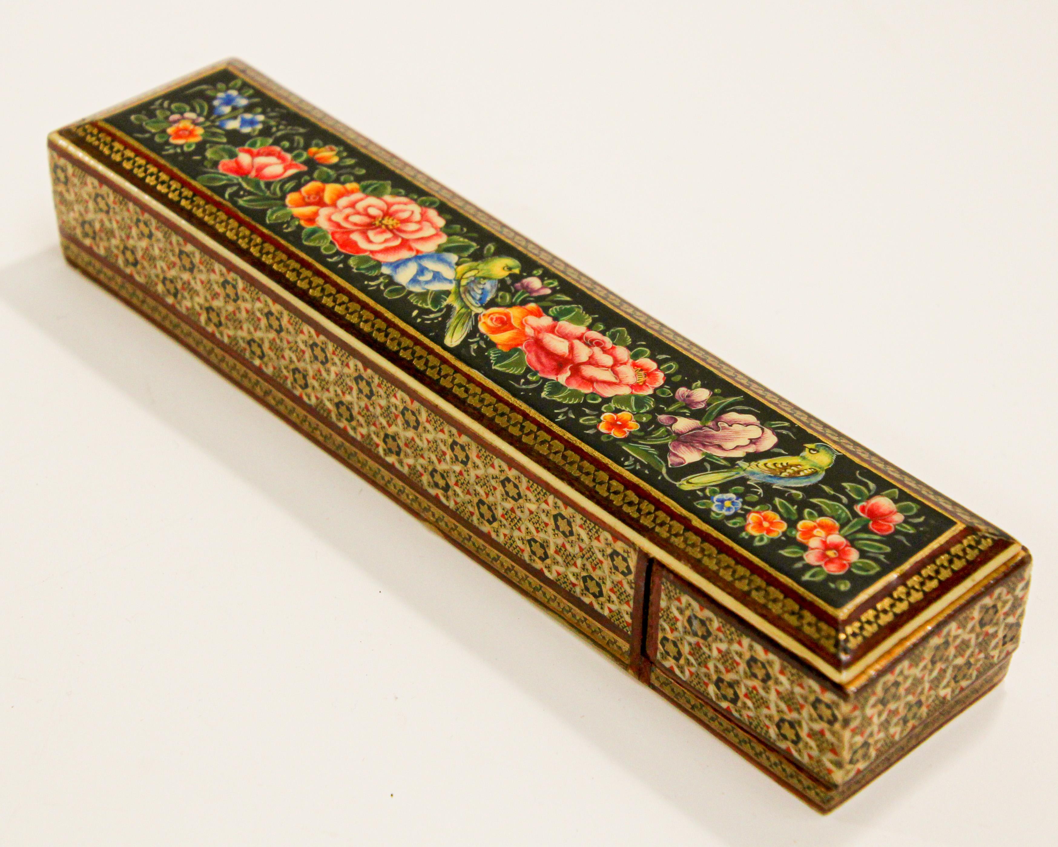 Middle Eastern Persian style hand painted lacquer pen box in rectangular shape.
Decorated with floral designs on black background.
Moorish pen box papier maché.
Size is 8