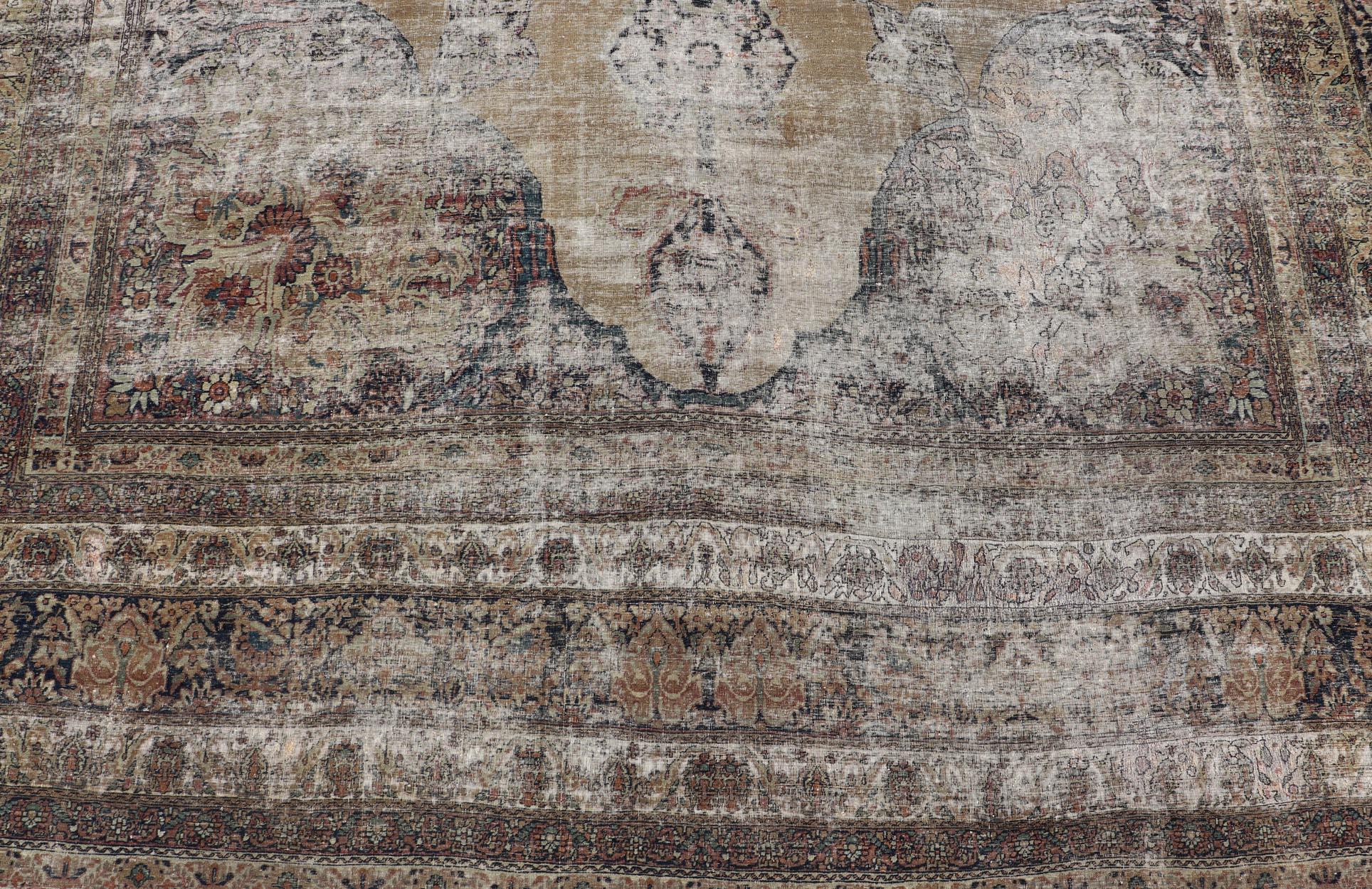 Late 19th Century Persian Lavar Kerman Rug with Faded Camel Medallion and Ornamental Border Motifs For Sale