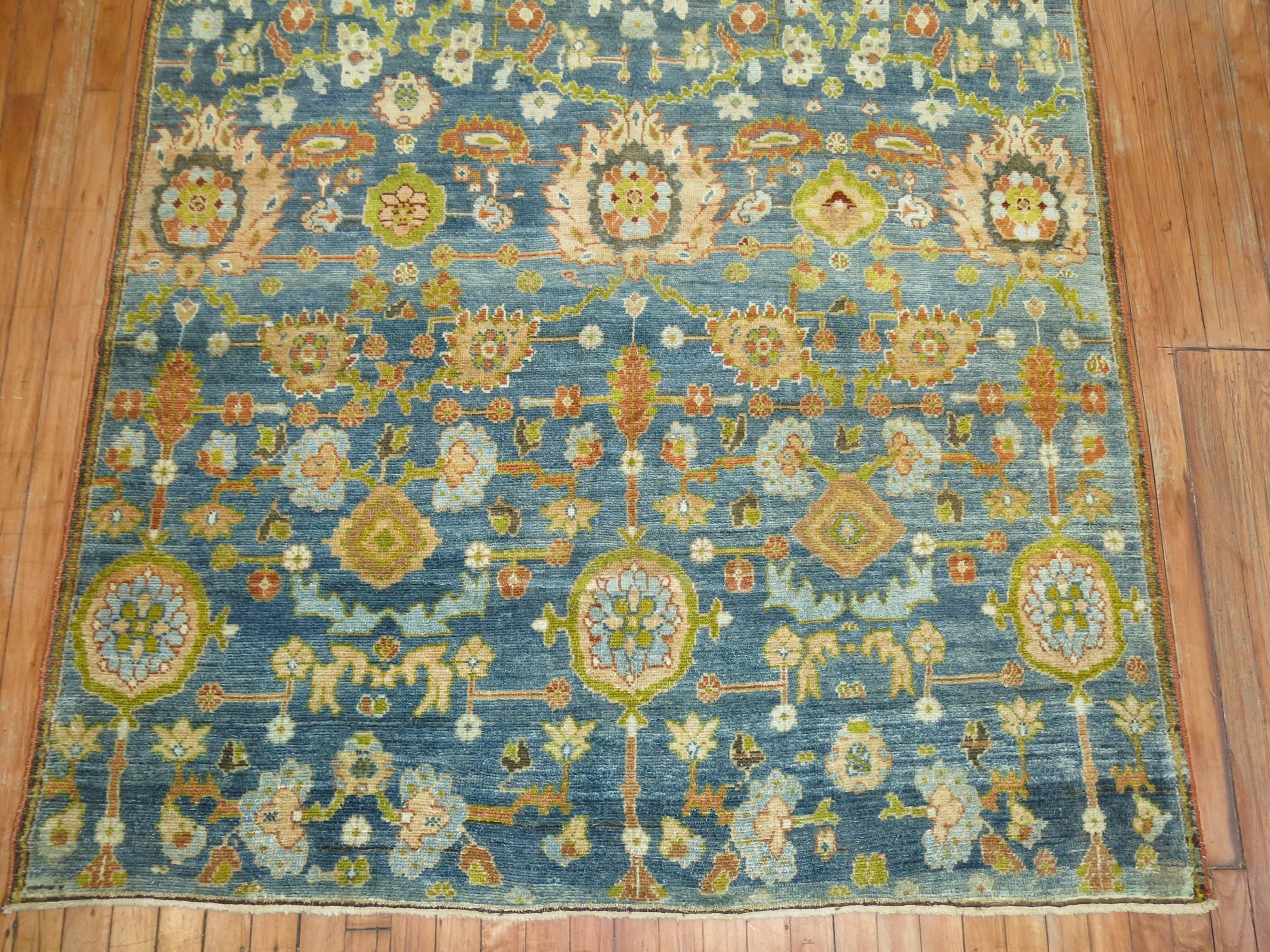 A Persian Malayer gallery rug featured a large-scale colorful all-over design.

5'1'' x 14'1''