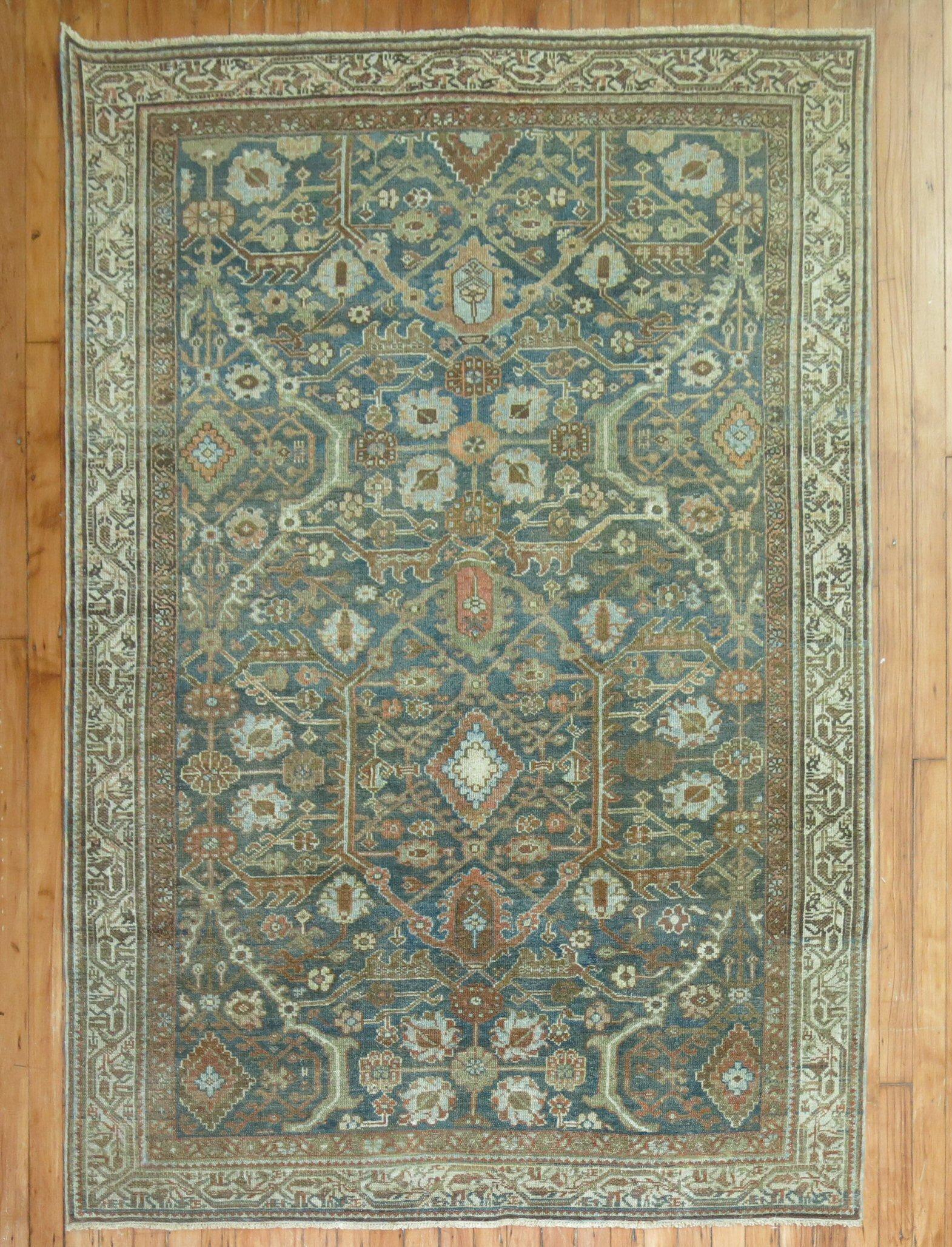 An accent size early 20th century Persian Malayer rug in green, ivory, and copper tones

Measures: 4'6