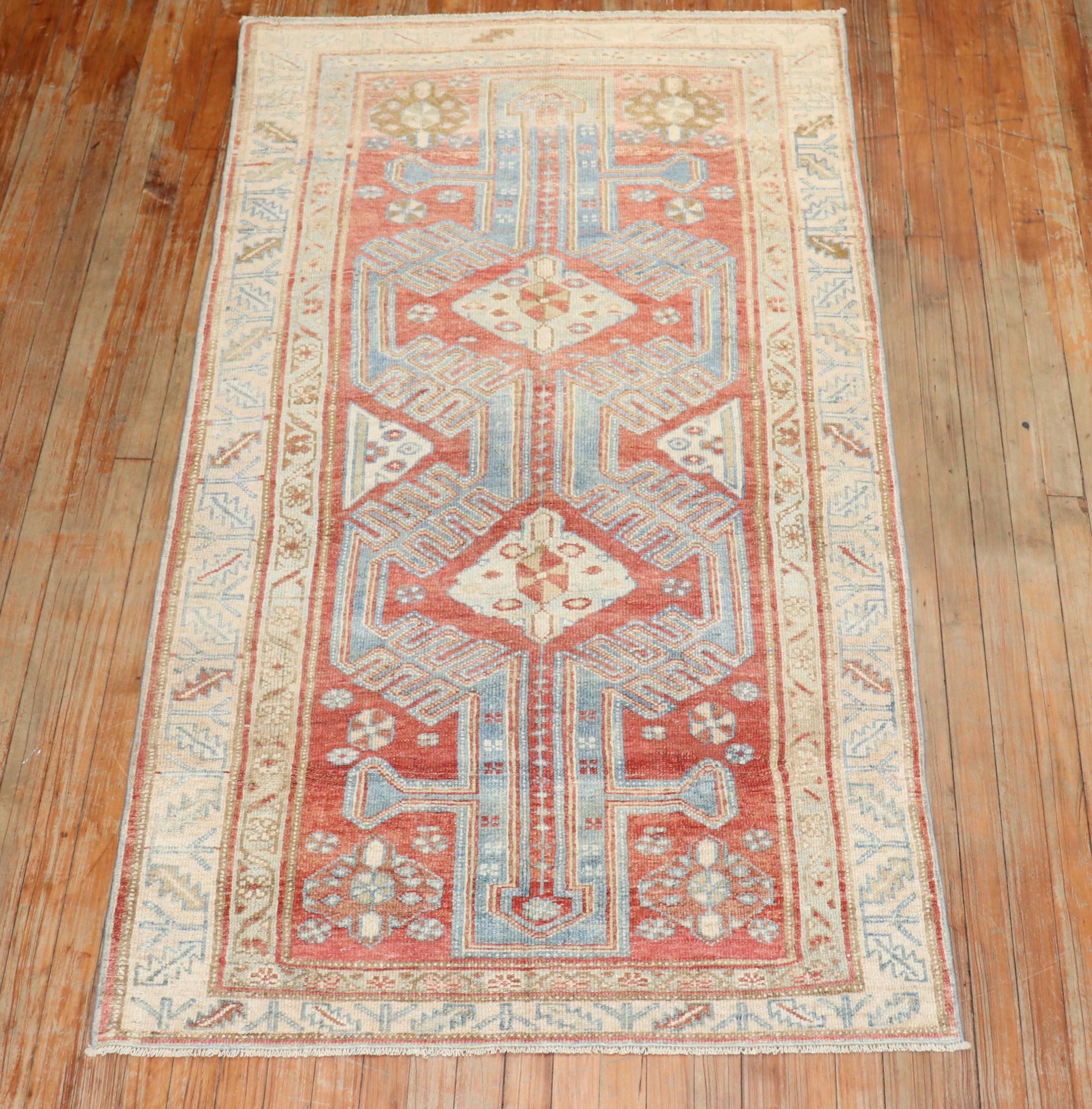 An early 20th Century Geometric Persian Malayer in red, blue and cream

Measures: 3'6'' x 6'5''.