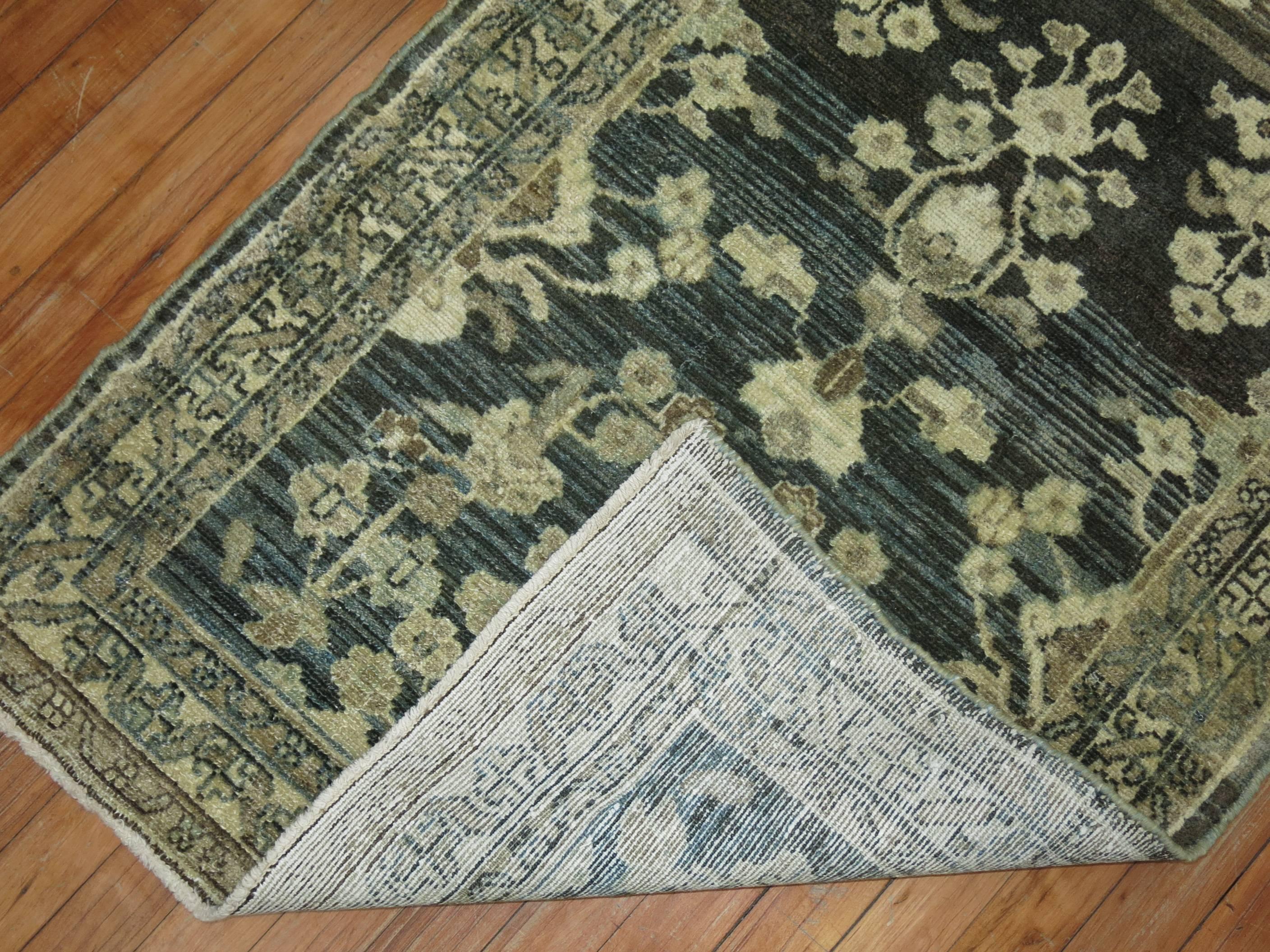 Early 20th-century Persian Malayer runner. Predominantly in charcoa, dark green l and gray.

2'8'' x 10'1''

