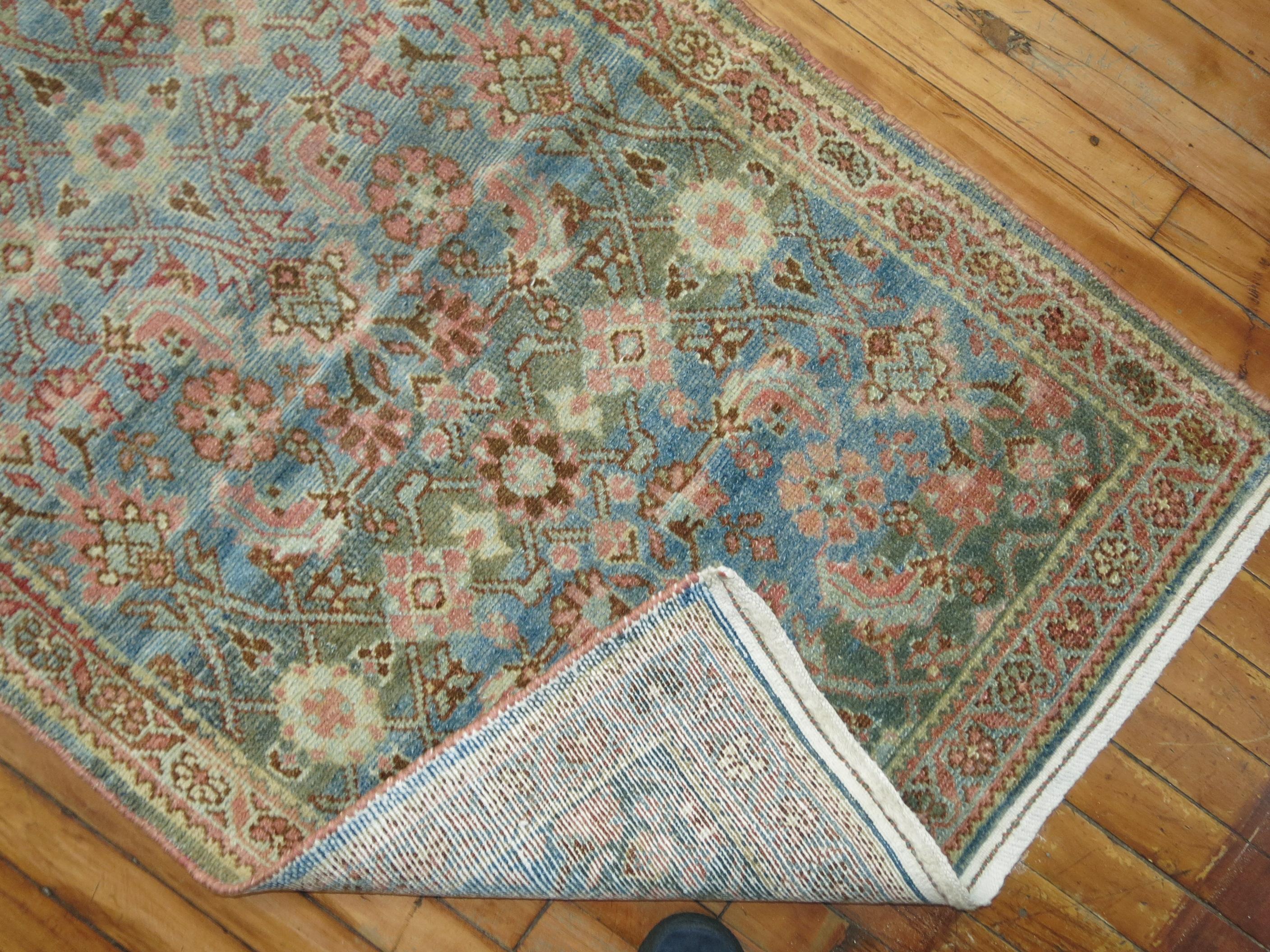 A long and narrow decorative earth toned Persian Malayer runner. 

2'8'' x 20'8''