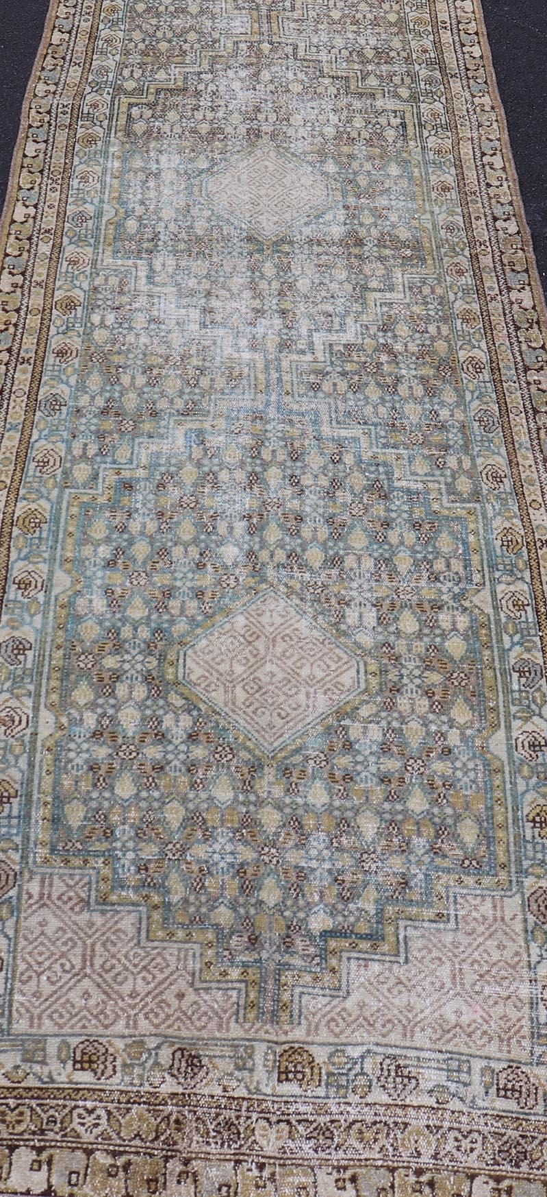 Persian Malayer Runner with Sub Geometric Medallions in Light Blue Field. Keivan Woven Arts / rug/TU-MTU-2702, country of origin / type: Iran / Malayer, circa 1920
Measures: 3'2 x 16'4 
This beautiful antique Malayer runner from Persia features an