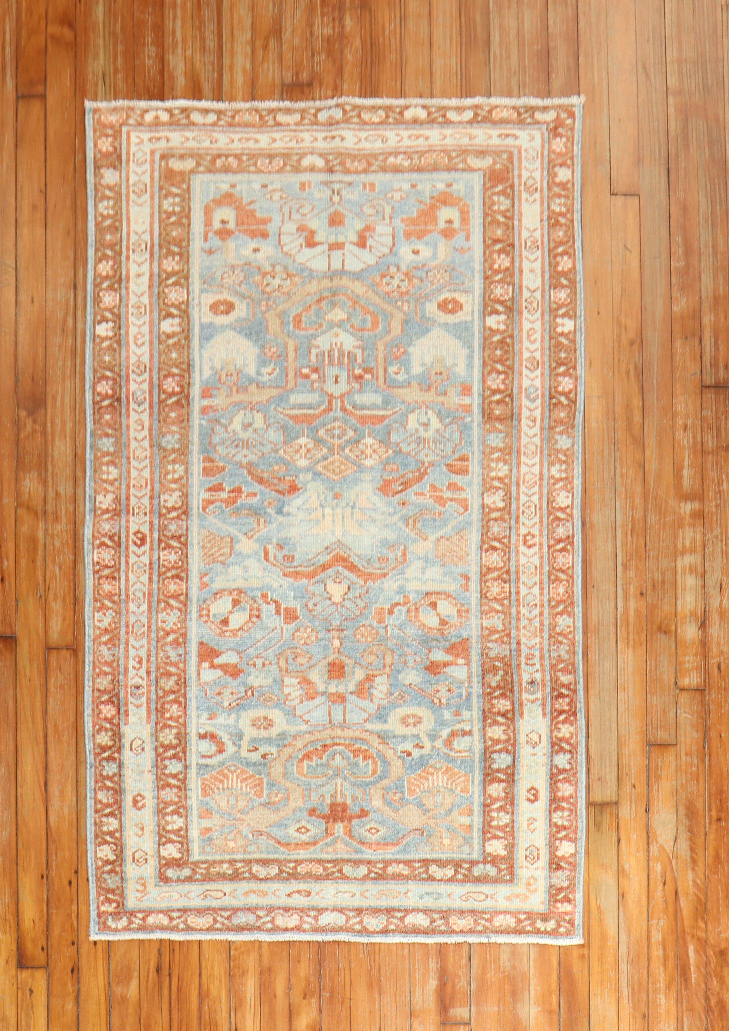 An antique Persian Malayer scatter size rug from the 2nd quarter of the 20th century in blue, brown, and rust

Measures: 3'2” x 5'.