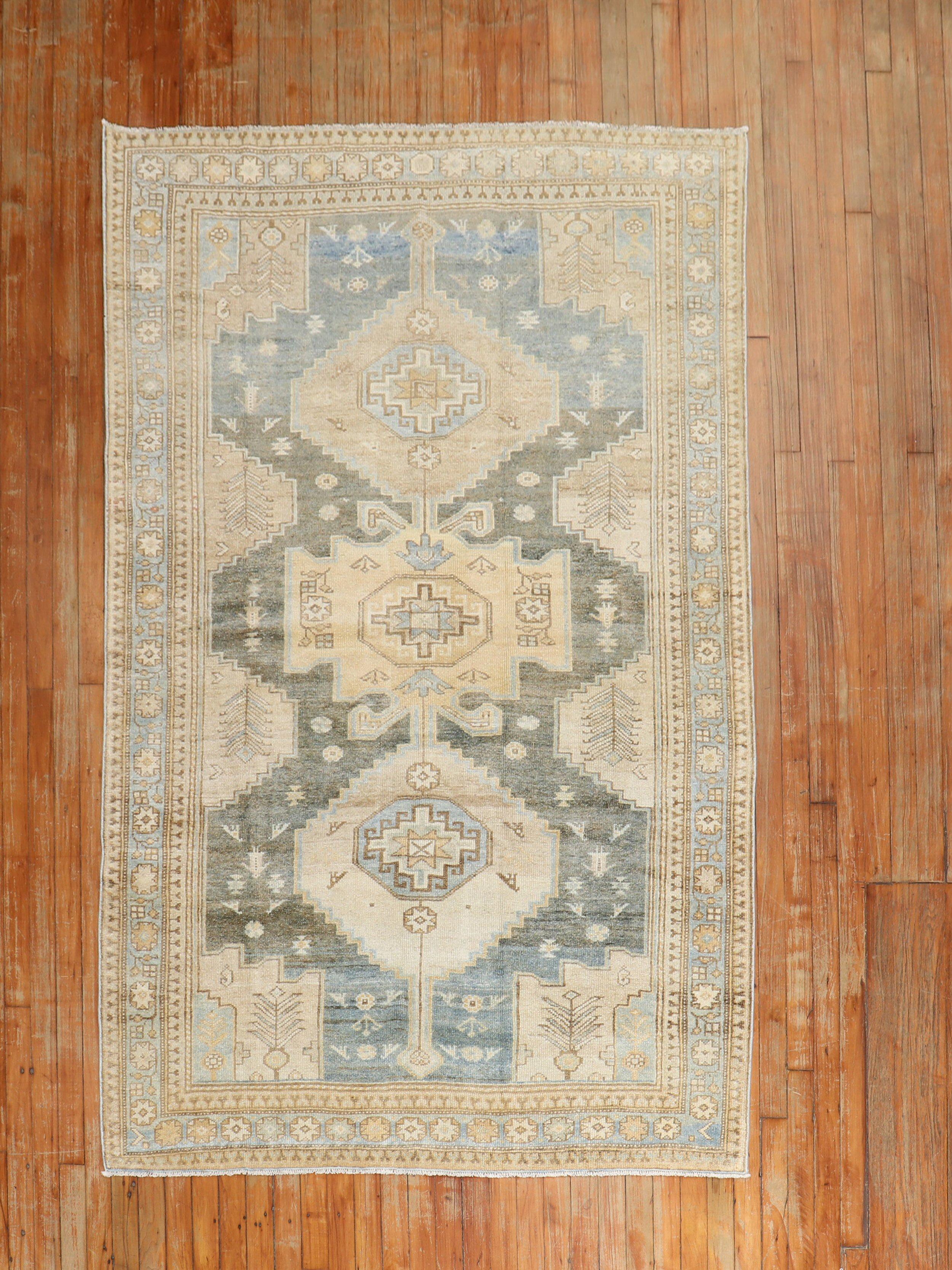 An antique Persian Malayer scatter size rug from the 2nd quarter of the 20th century in blue, brown, sand, gray, and camel tones

Measures: 4'7” x 7'3''.