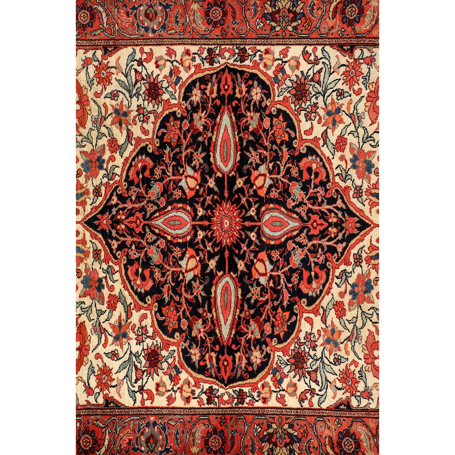 This antique Persian Meeshan Malayer carpet circa 1900 in pure wool and vegetable dyes consists of a hand-knotted handspun pure wool pile, cotton warp, and wool weft. A four-pointed medallion anchors the design, symbolizing the four natural elements