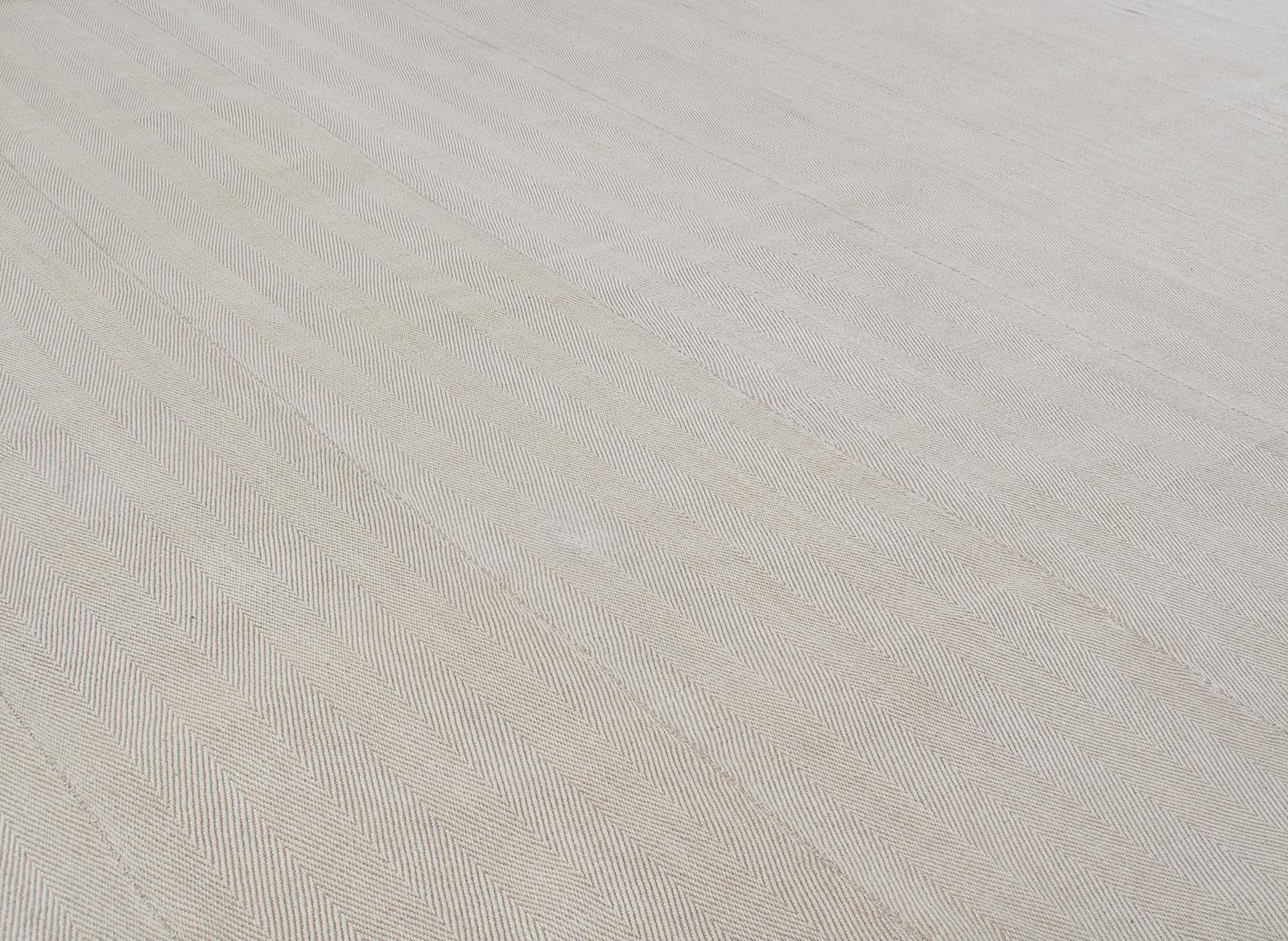 This Persian Pelas flat-weave rug is made in Iran with the finest hand-carded, hand-spun wool. The subtle palette is a product of all natural dyes taken from regional plants and minerals. Nasiri practices low impact manufacturing processes while