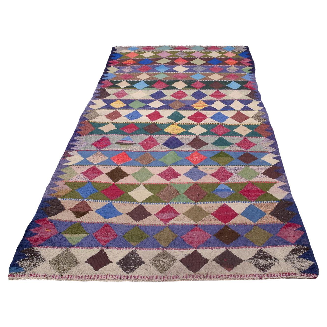 Nomade persan Harsin Kilim. Grand tapis en laine noué à la main. Triangles multicolores. en vente