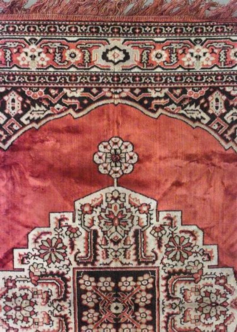 Persian orange and blue velvet table cover with red center, fringe, and border