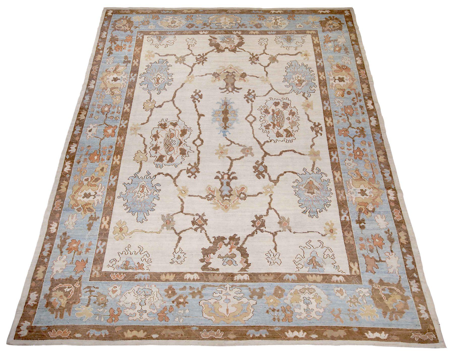 Discover the elegance of Persian Oushak featuring Area Rugs in Circa 1990. Designed with Wool and BlueBrownIvory, this exclusive design is perfect for enhancing your space.