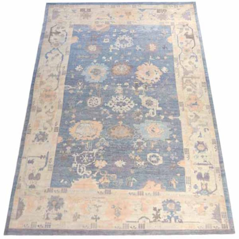 Discover the elegance of Persian Oushak featuring Area Rugs in Circa 1990. Designed with Wool and BlueIvory, this exclusive design is perfect for enhancing your space.