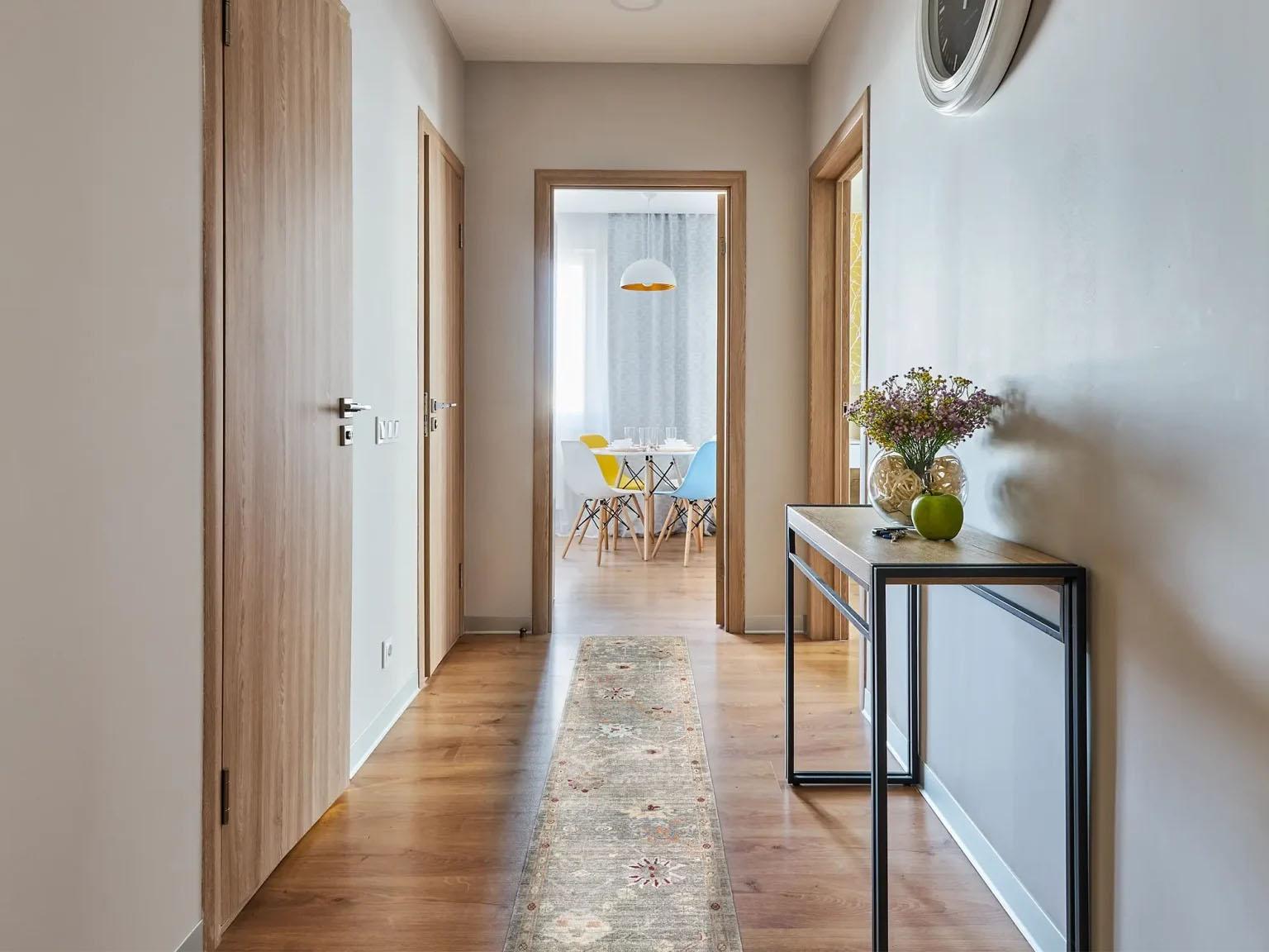 Graceful Pathways: A Persian Oushak Transitional Wool Runner
Transform your hallway or long corridor with the sophisticated charm of this exquisite Persian Oushak runner rug. Originating from Iran, this piece beautifully marries classic design with