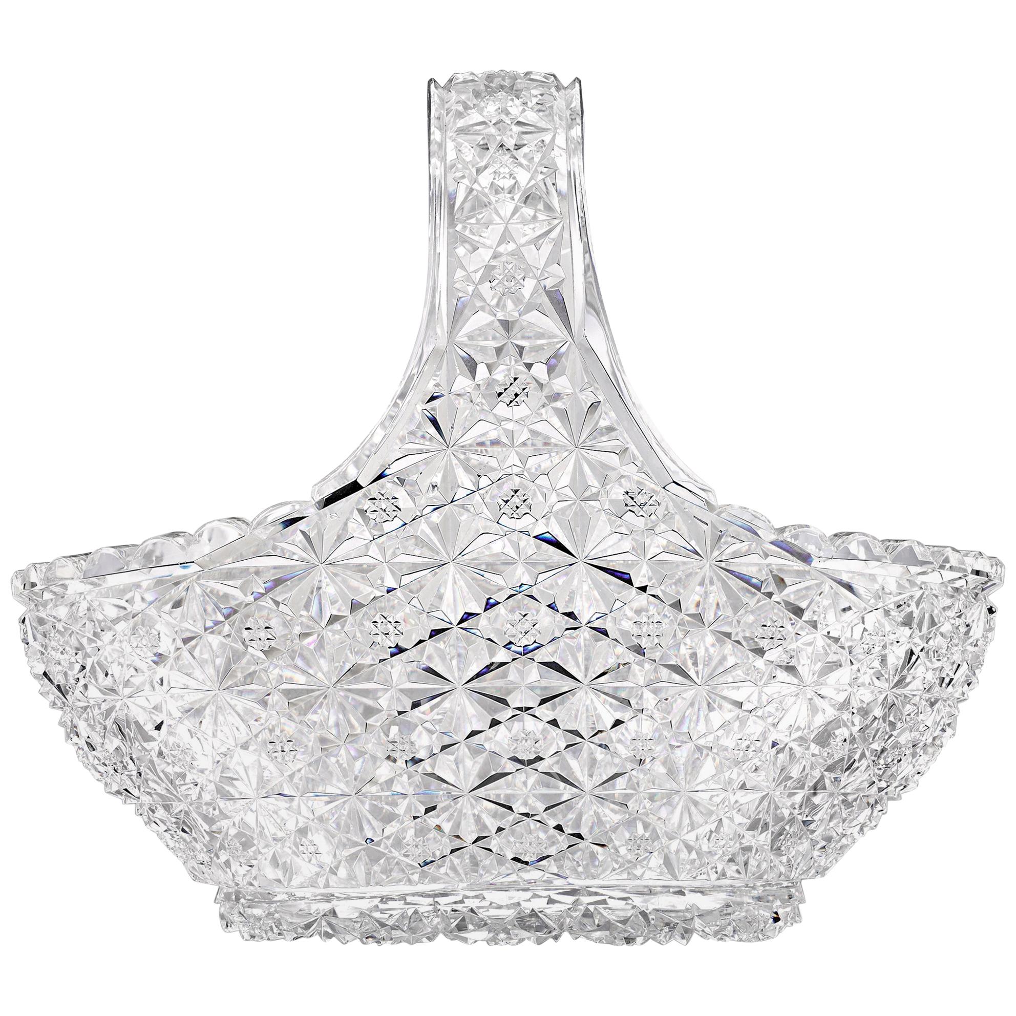 Complex, intricate cuts cover the entire surface of this stunning cut glass basket featuring the exotic Persian variation of the Russian pattern. American Brilliant period cut-glass won world acclaim in the 19th and 20th centuries, recognized for
