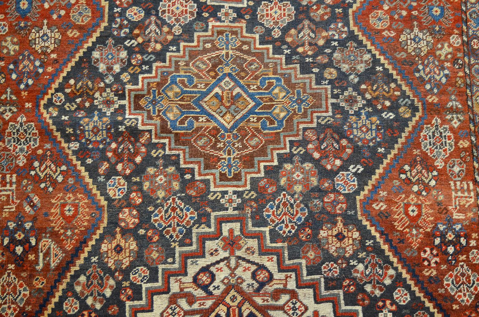 This Persian Qashqai carpet, circa 1880 consists of a pure handspun wool warp, weft and hand knotted pile and organic vegetable dyes. It demonstrates the Classic playful geometric style of these Qashqai pieces utilizing a pleasing overall layout and
