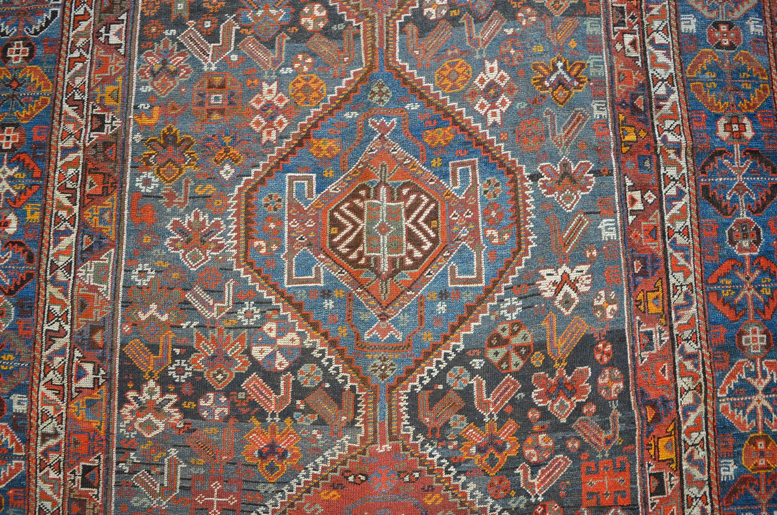 This Persian Qashqai Neriz carpet, circa 1880, consists of a pure handspun wool warp, weft and hand knotted pile and organic vegetable dyes. The Classic Qashqai geometric style with multiple medallions can be seen in this carpet alongside smaller
