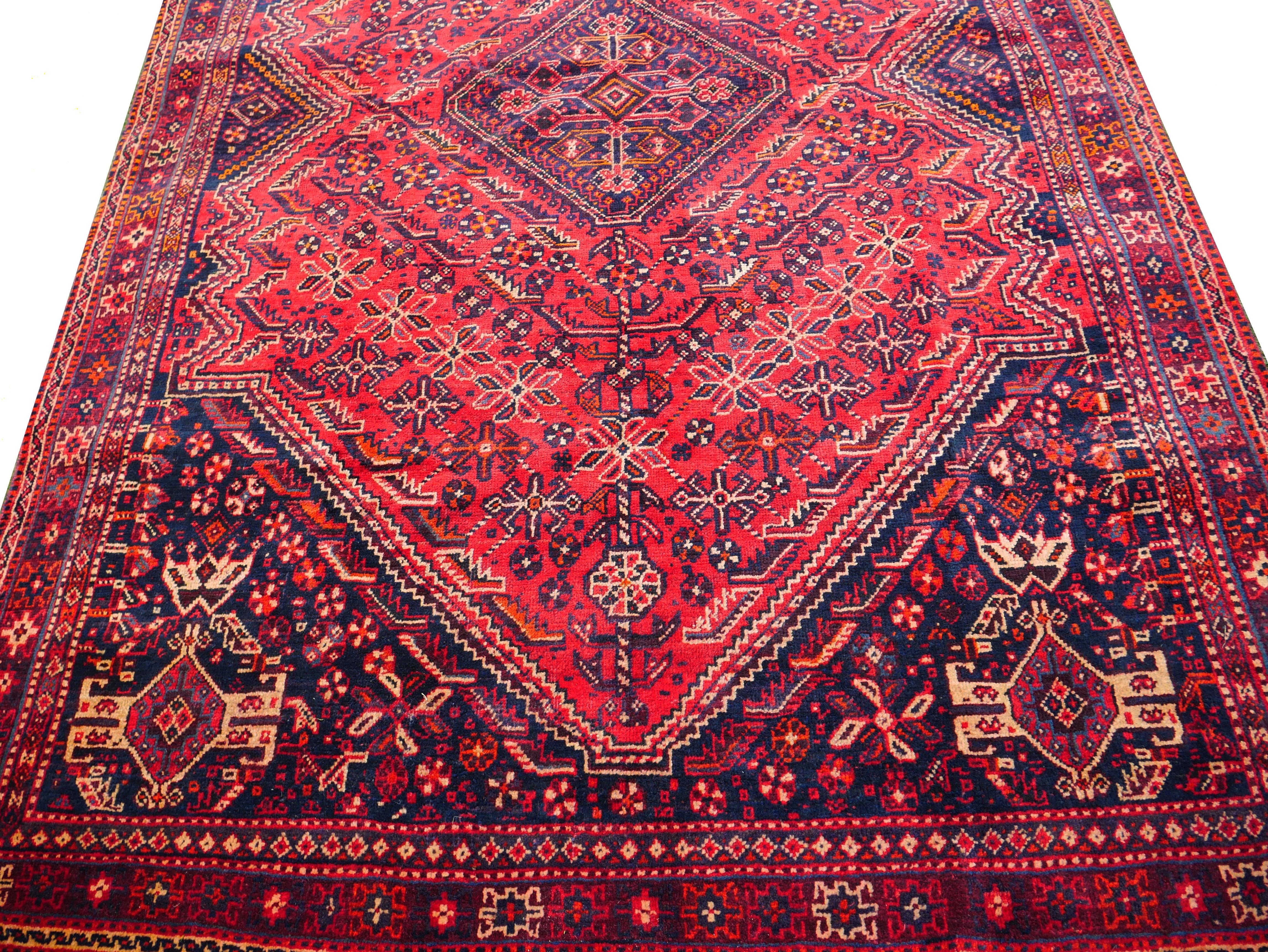 This is an all-wool nomadic carpet from the Zagros Mountains in southwest Iran. It is attributed to the Qashqai pastoral tribe and it features all the Classic motifs used by the Qasqai women for the past centuries. 
Measurements: 253 x 163cm or 5.3