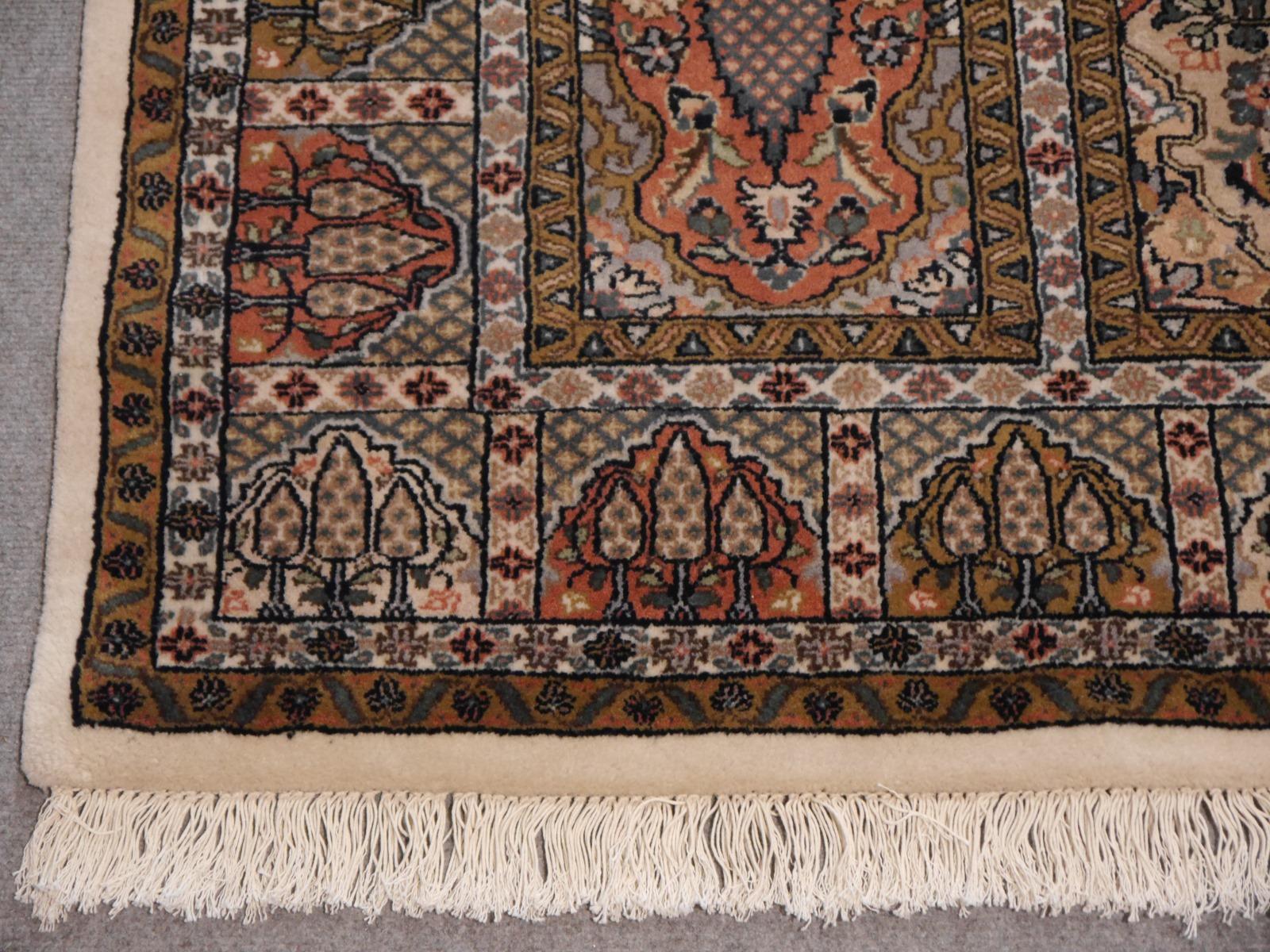This beautiful hand-knotted oriental rug was made of fine wool. It is very decorative and has a stunning luster. The tile shaped fields contrasts with the creme border. The carpet has a lot of character to give a room an elegant finish. It is fresh