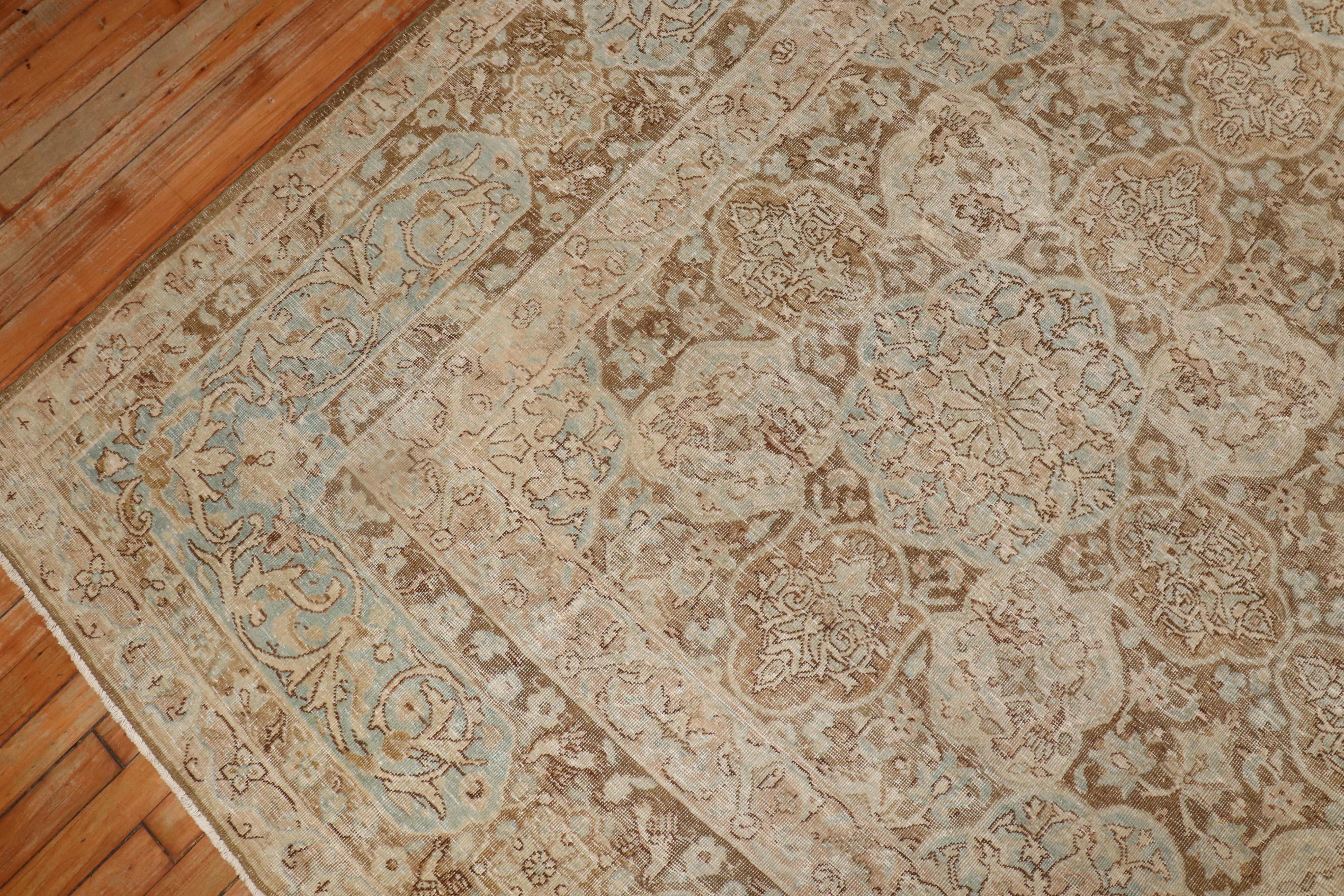 1940s Persian rug in warm brown, ivory and light blue tones

Measures: 8'5'' x 11'6''.