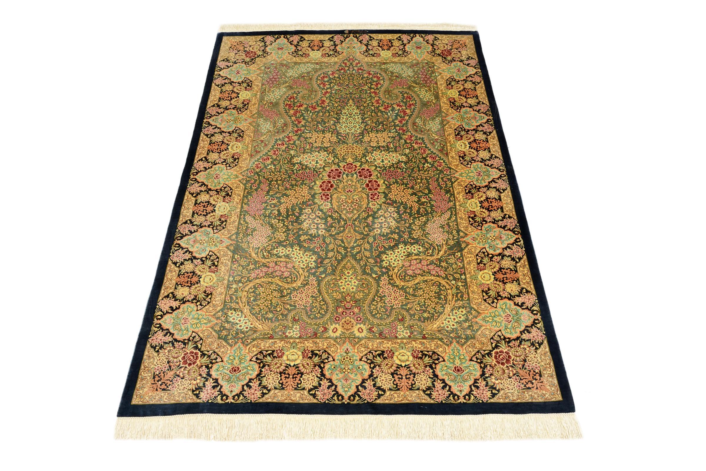 A gorgeous Persian rug, Qum silk, 20th century.
A Persian silk rug stands for pure luxury. This rug in particular, since Qom (also called Qum) silk rugs are known to be the most sophisticated and to count among the finest Persian rugs. Only a