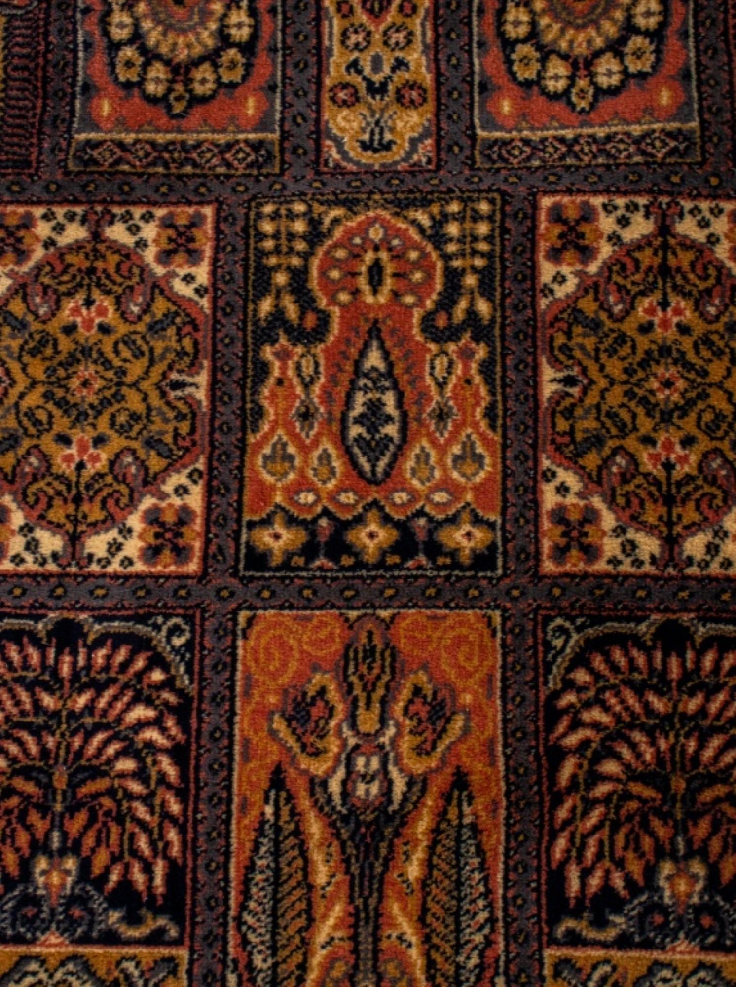 Persian carpet with dominate brown tones, the  field geometrically divided and depicting  stylized flora and fauna. 
Dimensions 
6' 1