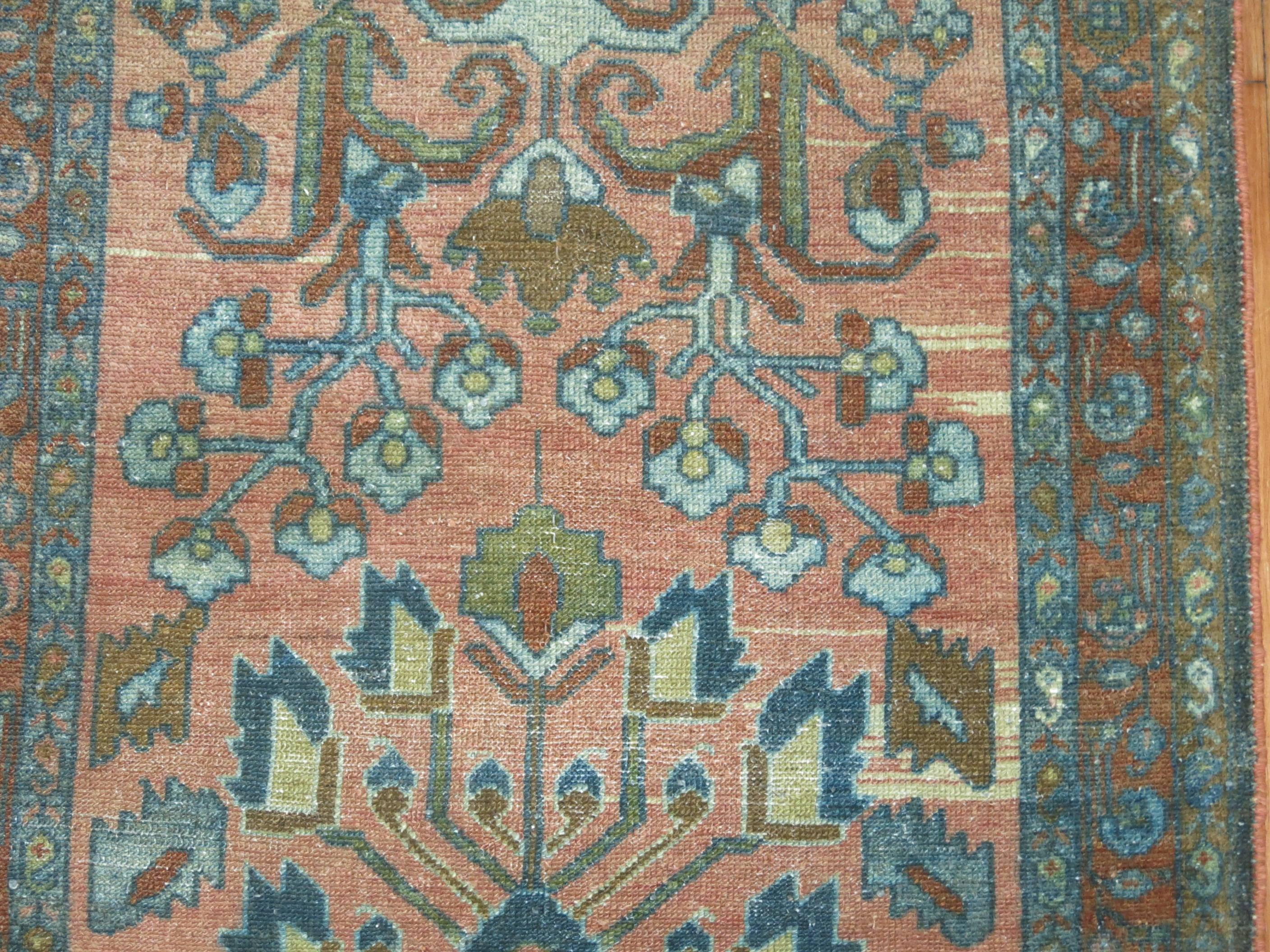 Antique Persian runner with a muted formal palette.