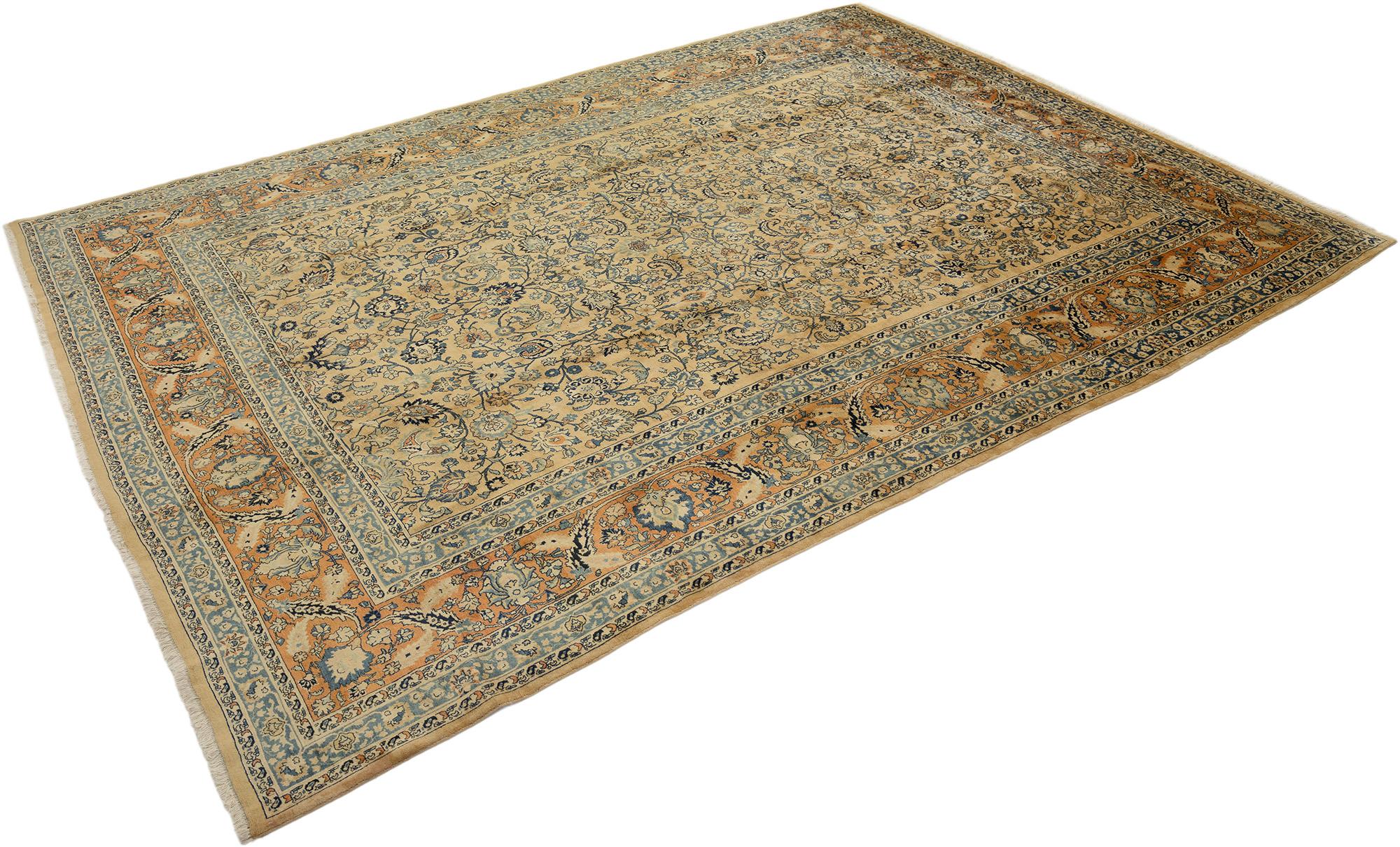 Hand knotted Persian Sarough rug, woven in Iran circa 1950.

This grand Sarough features an intricate allover floral design rendered in soft beige and blue tones, framed by a rich rust border decorated with stylized blossoms and arabesques. The