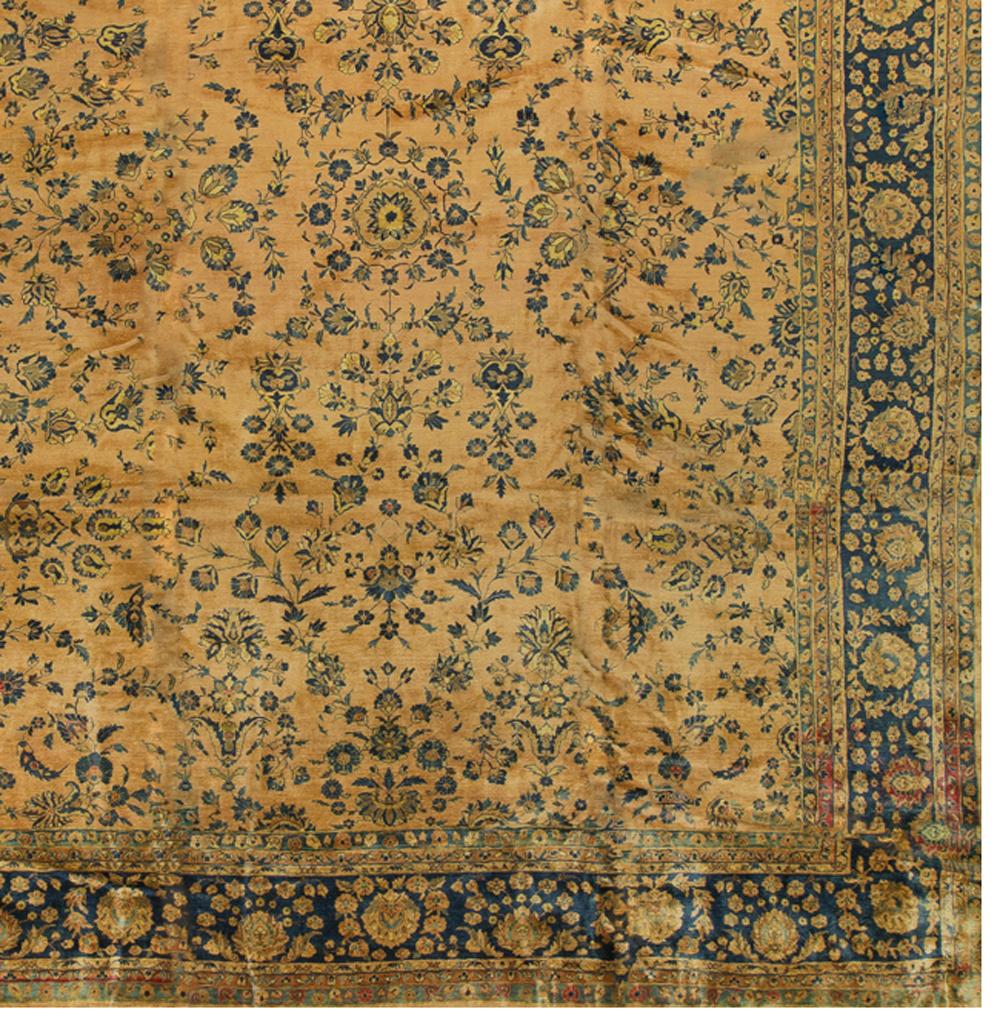 Persian Sarouk rug carpet, circa 1920. The distinctive colors of this Sarouk rug reflects the style that became so popular in the USA at the beginning of the 20th century. The soft rust-red ground so well complimented by the floral patterns in blues