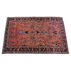 Persischer Sarouk mit Korallenfeld und Navy-, Blau- und Elfenbeintönen um 1920