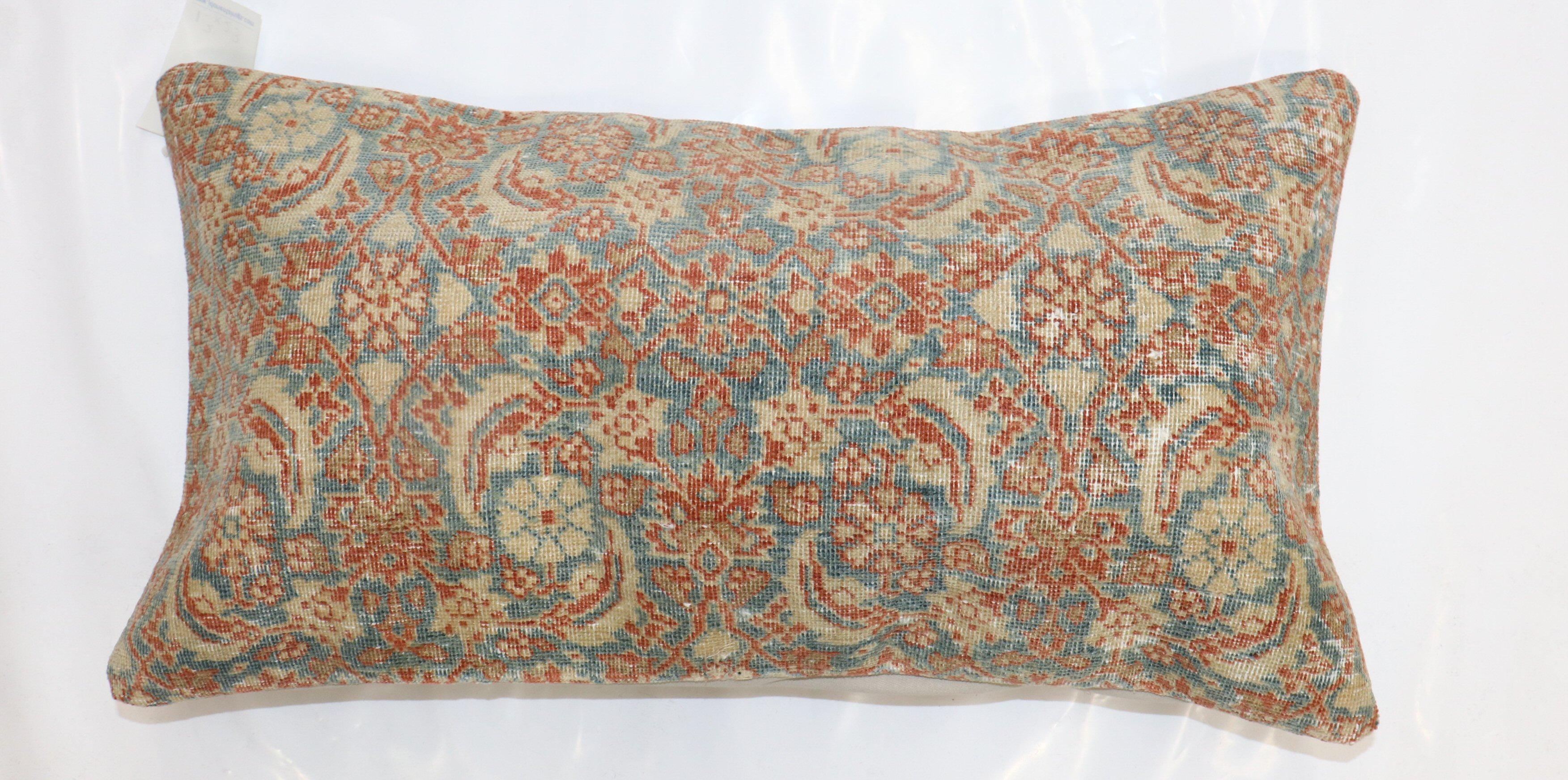 Pillow made from a finely woven persian senneh rug.

Measures: 14'' x 26''.