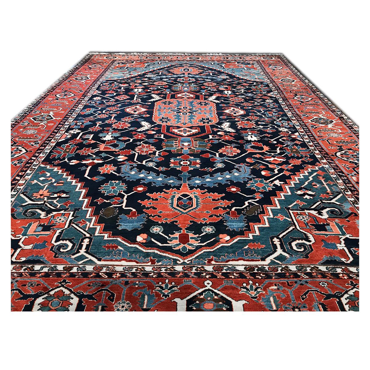 Ashly Fine Rugs presents an original Vintage Persian Serapi palace-sized area rug. Part of our own previous production, this antique recreation was thought of and created in-house and handmade in Persia by our master weavers. Persian Serapi rugs are