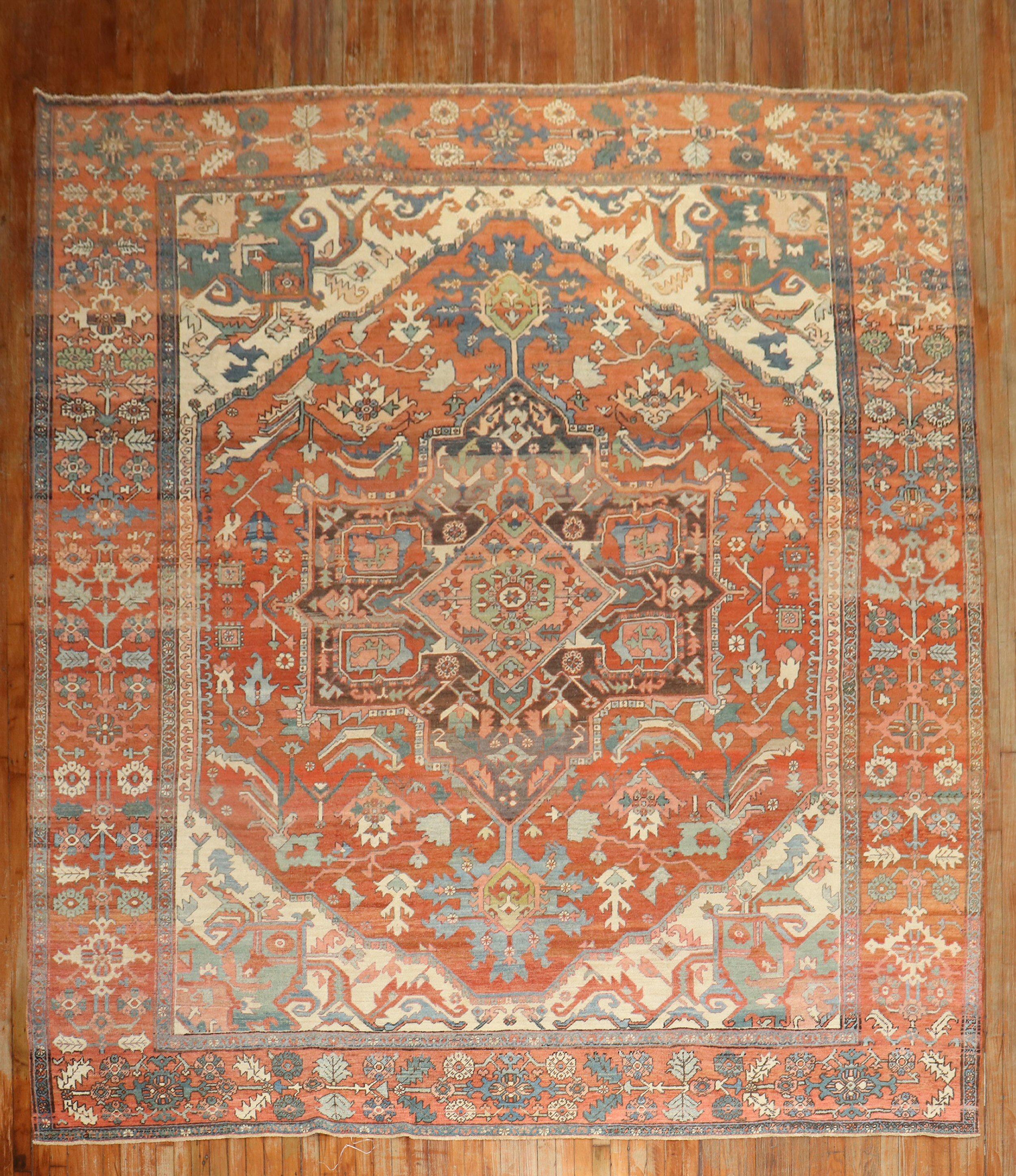 An early 20th century Persian Heriz Serapi rug

Measures: 10'2'' x 12'7''.