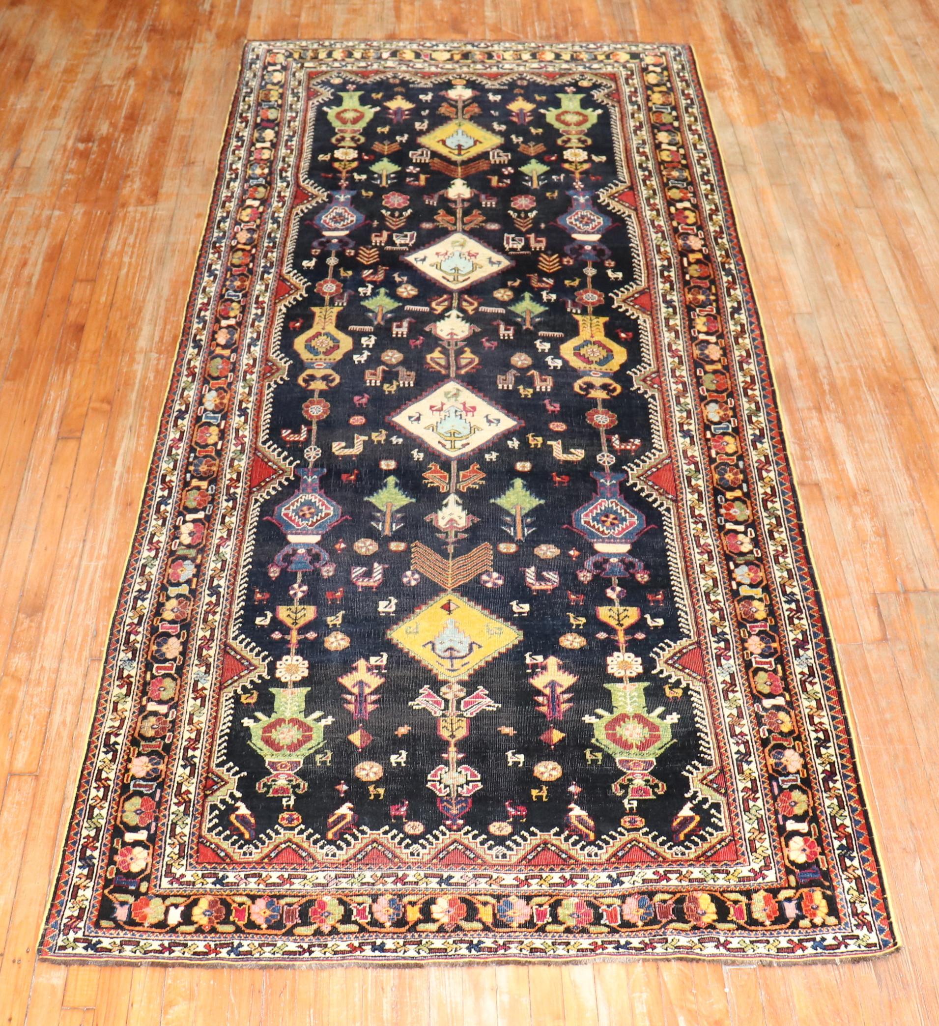 An early 20th century Persian Shiraz Gallery size rug

Measures: 4'11'' x 11'8''.