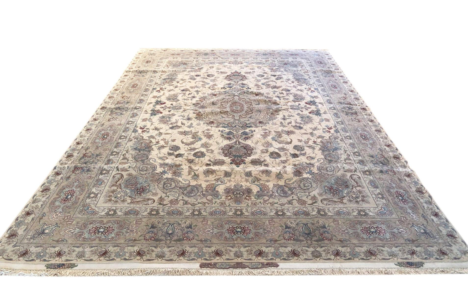 This rug is a hand knotted master piece Persian Tabriz rug with a great quality. This rug features a floral medallion pattern and the pile is wool and silk with silk foundation. The size is 8 feet by 2 inches wide by 11 feet 10 inches tall. In this