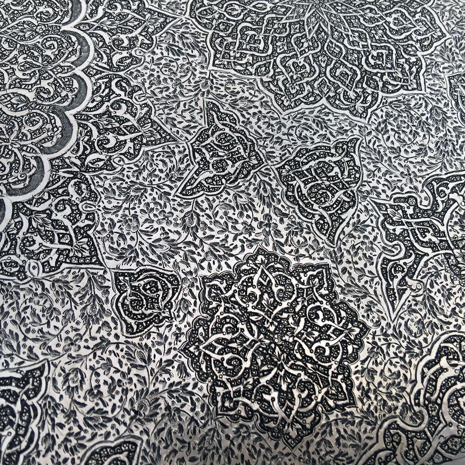 Something very different and very special. This sterling silver tray was made by the most famous of the Isfahan silversmiths , Mohammed Taqi who was working in the early years of the 20th century. This heavy tray is finely hand engraved and has the