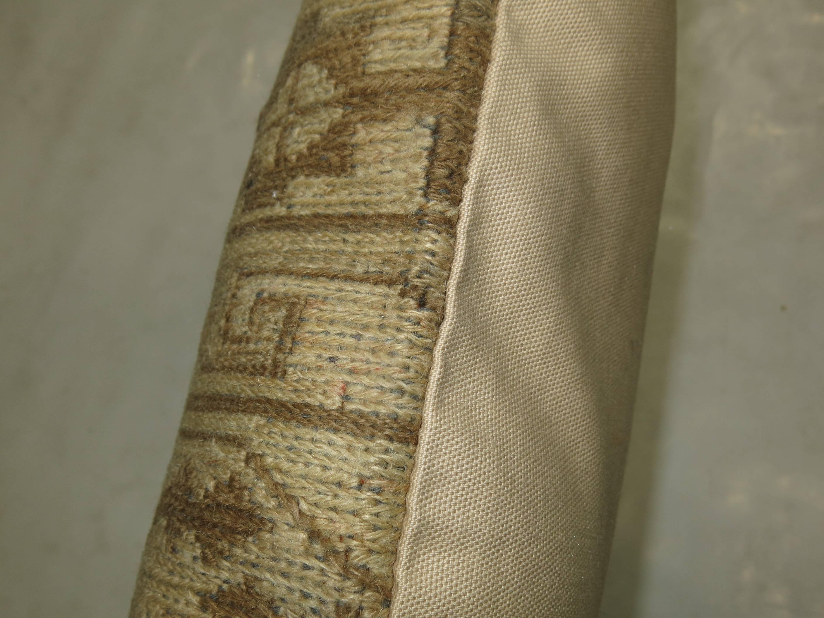 Pillow made from a muted vintage Persian Soumac rug.