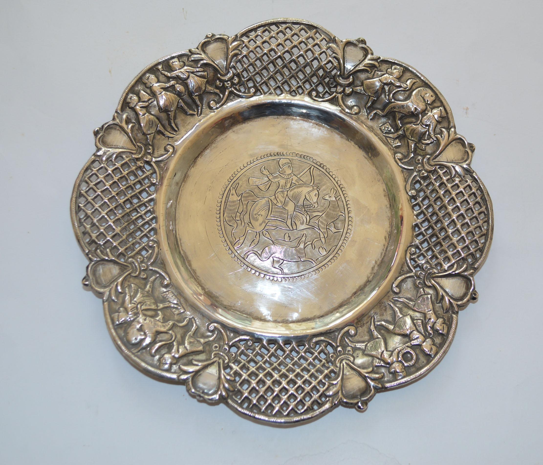 Fine antique Middle Eastern Persian style hand chased hand pierced silver dish. 
Hammered and chased with central scene hunting scene , with intricate pierced open work lattice design edges with 4 figurative scenes. 
Weight 151 grams silver approx