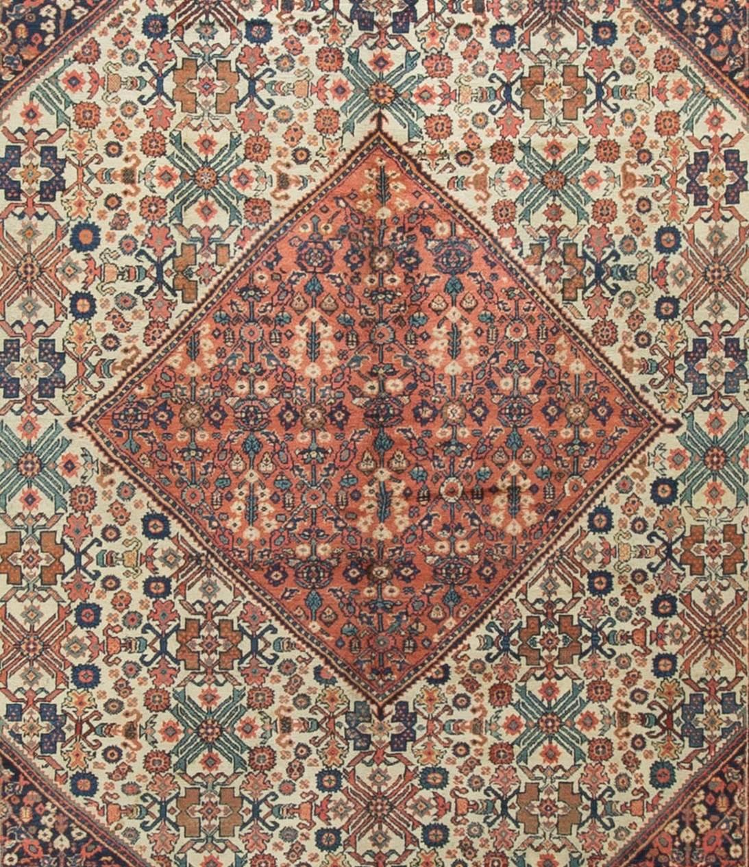 Antique Persian Sultanabad rug, circa 1890. Lovely soft ivory ground filled with flower elements surrounding a central motif. Size: 9'1 x 12'1.