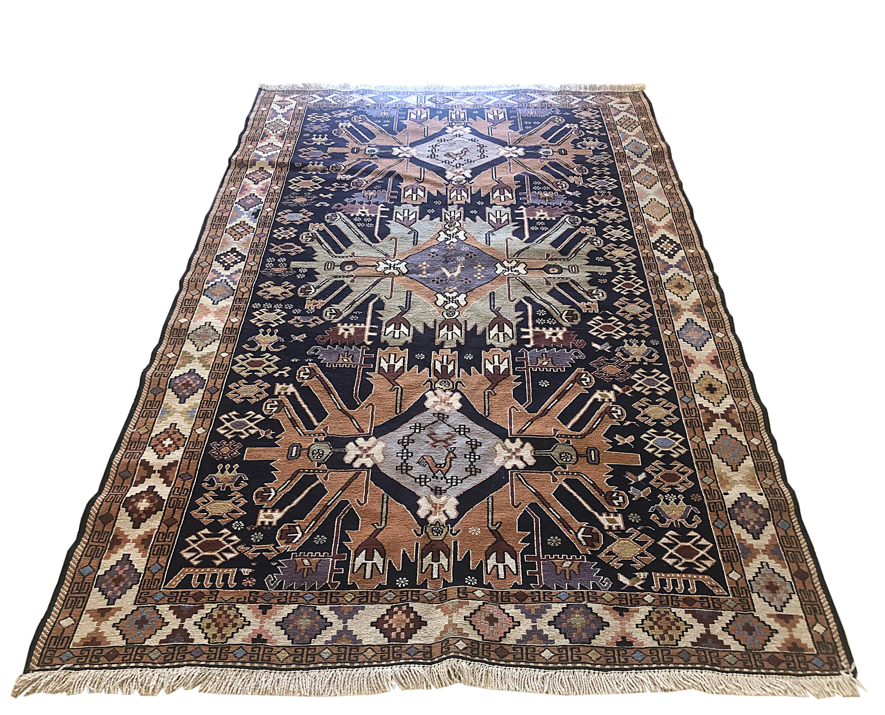 This rug is a Sumak rug which is a type of brocading or flat-woven pile. This is a flat-weave, rug that is thicker than the Kilim and very sturdy however they are not reversible like Kilims due to the non-clipped yarns are left on the back. The pile